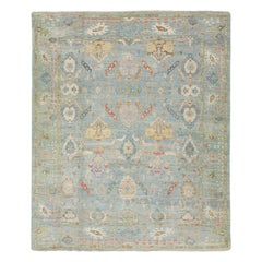 Il moderno Sultanabad Rugs di Apadana è un tappeto di lana lavorato a mano in azzurro, con disegni tridimensionali.