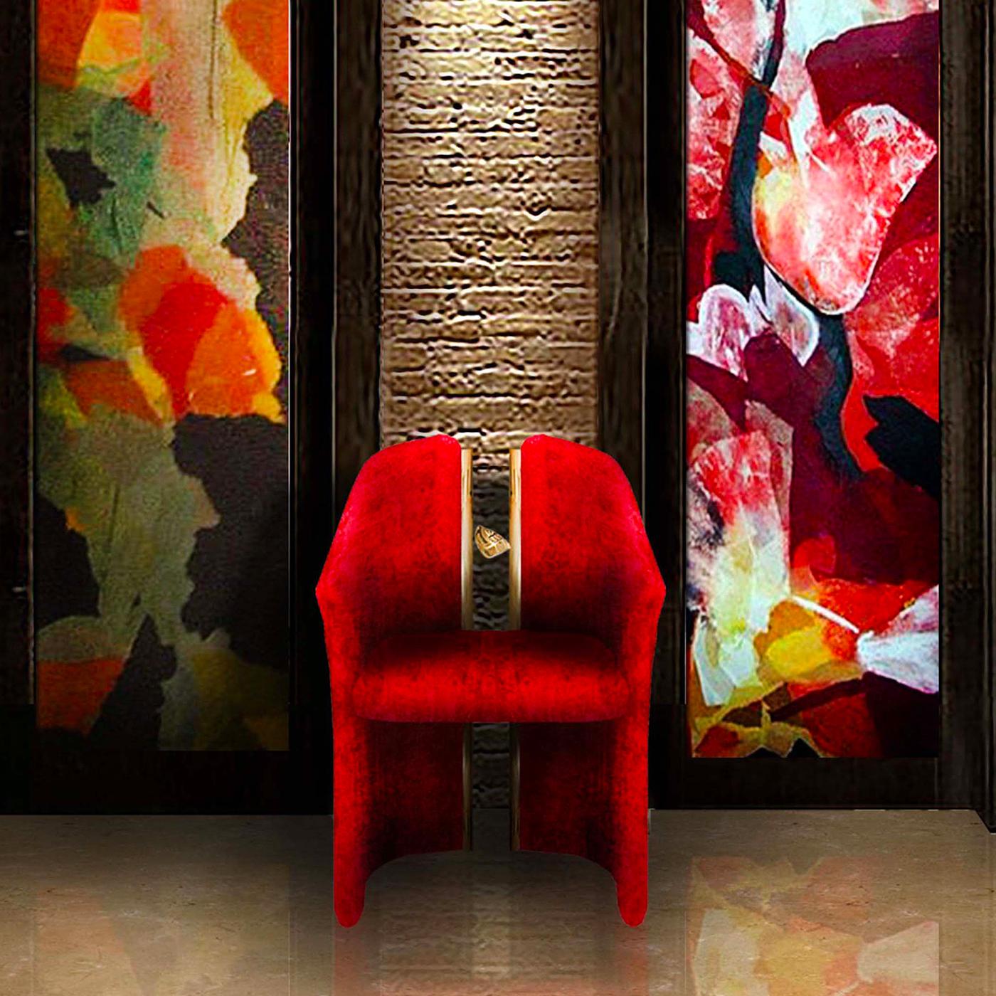 This stunning armchair is a work of functional art that will make a statement in a modern living room or eclectic dining room. Its poplar frame upholstered in red velvet plays with the harmony between full and empty volumes, creating two separate
