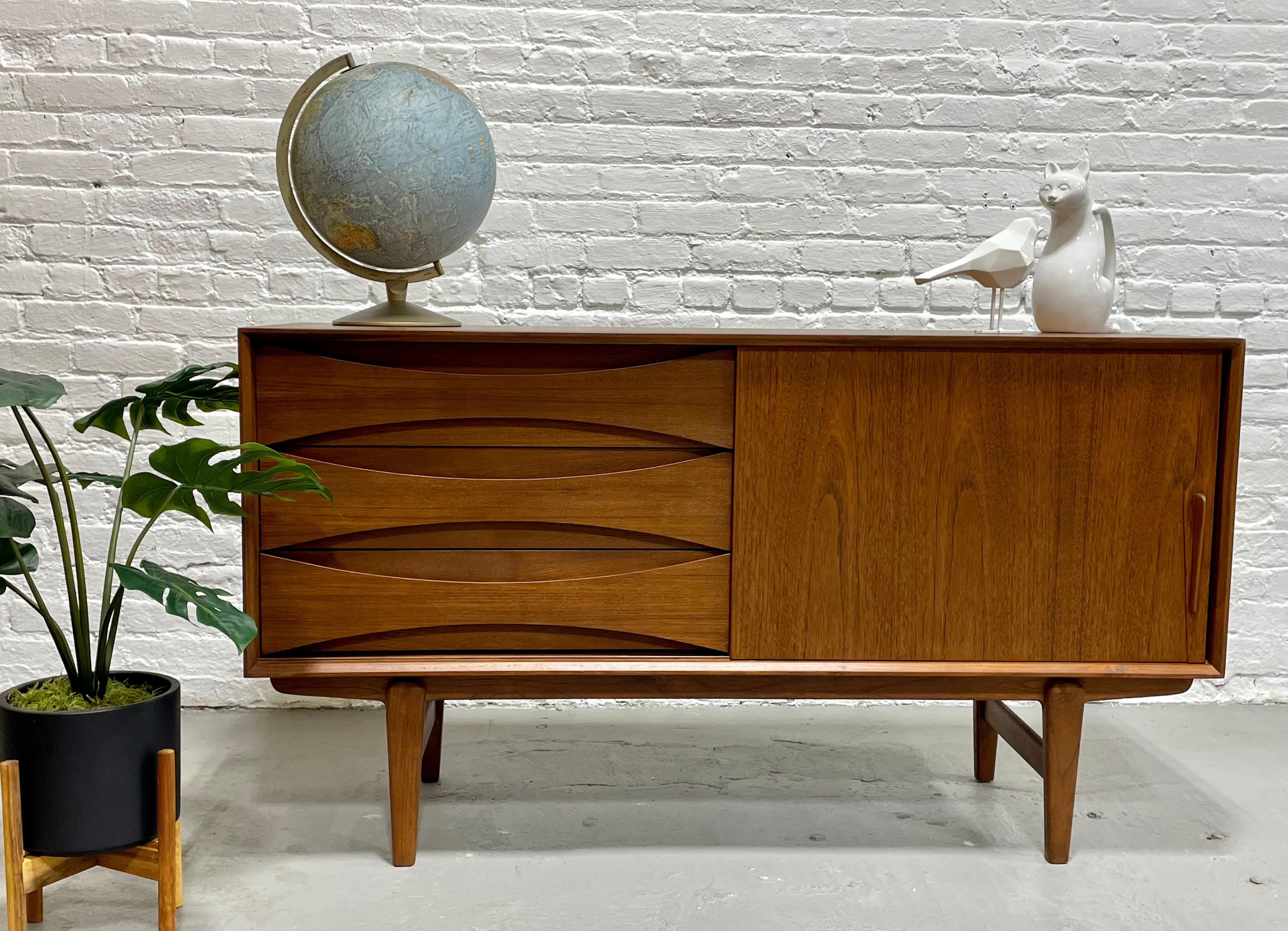 Perfect smaller sized Handmade Mid Century Modern styled credenza / media stand with superb leg design. Thoughtful layout for a media stand - shelving for components along one side and streamlined drawers for remotes and other storage on the other
