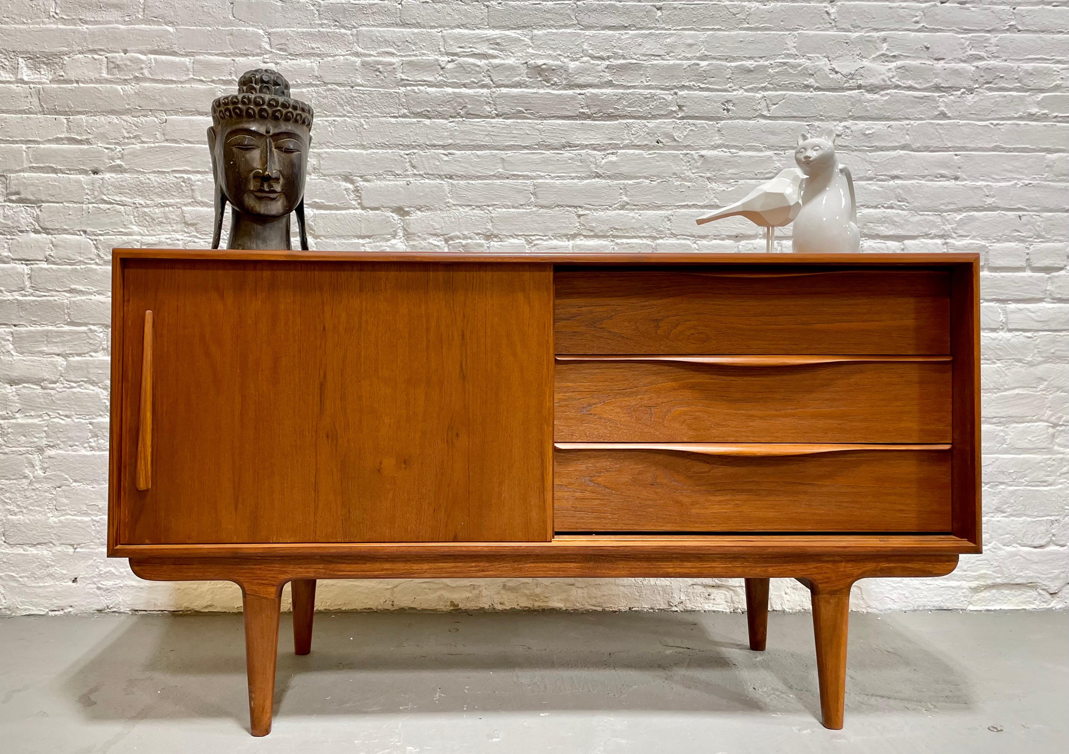 Perfect smaller sized Handmade Mid Century Modern styled credenza / media stand with superb leg design. Thoughtful layout for a media stand - shelving for components along one side and streamlined drawers for remotes and other storage on the other