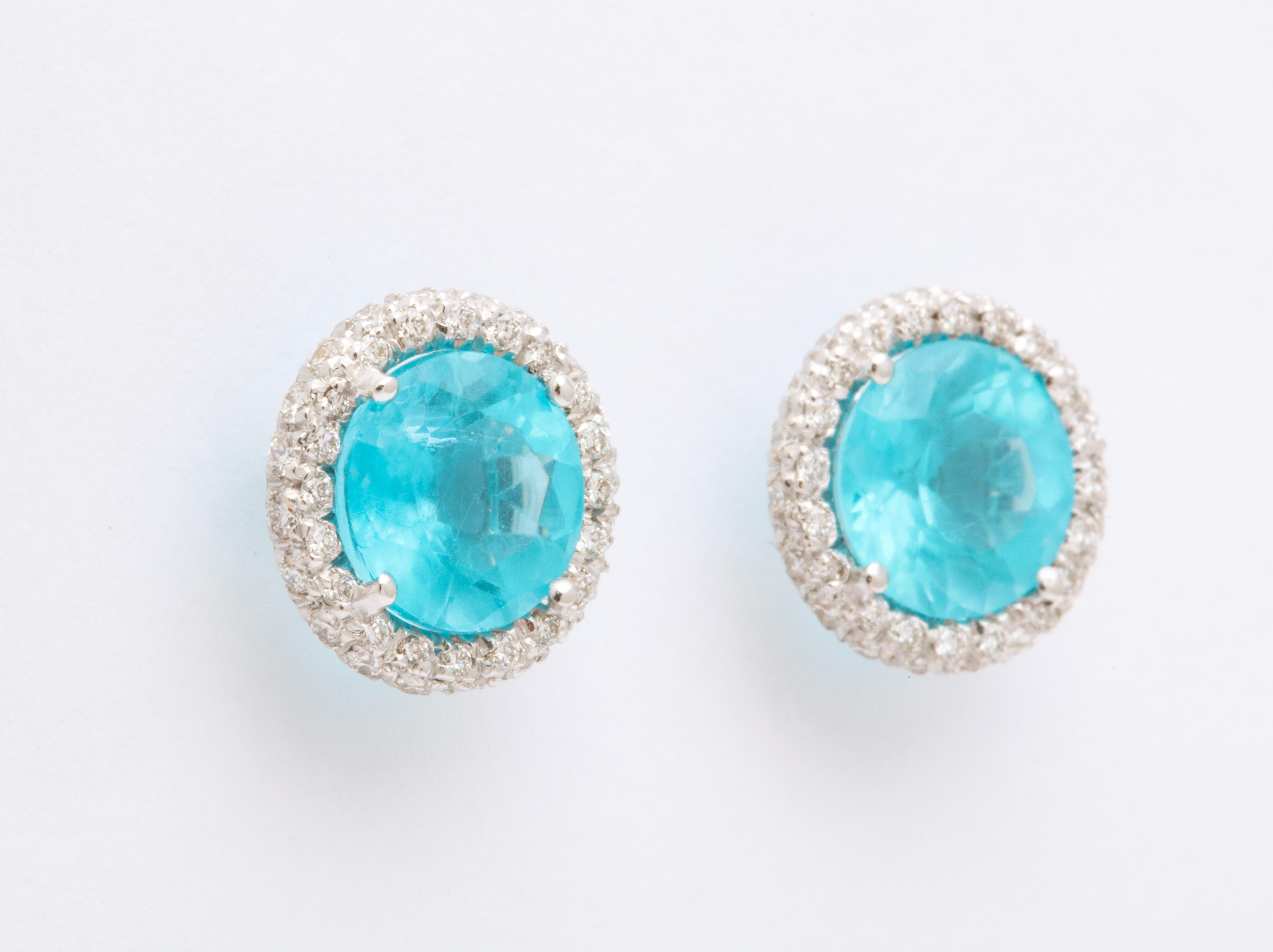 Bright blue apatite are surrounded by micro pave set diamonds to create these unique stud earrings.  Easily wearable, bold and unique, these are destined to become someone's go to earrings for years to come.
For pierced ears with extra large backs
