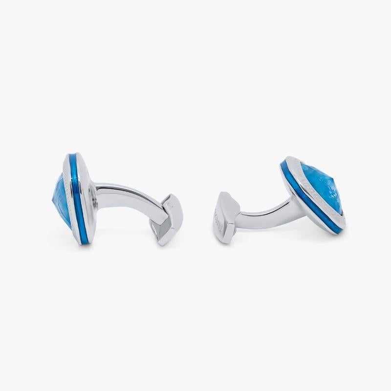 Apatite Doppione Cushion Cufflinks in Sterling Silver

Rose cut Apatite sits below a cabochon of quartz, cleverly combined to create a 'doublet'. This unusual collaboration of semi-precious stones inlay our classic square case, with blue enamel