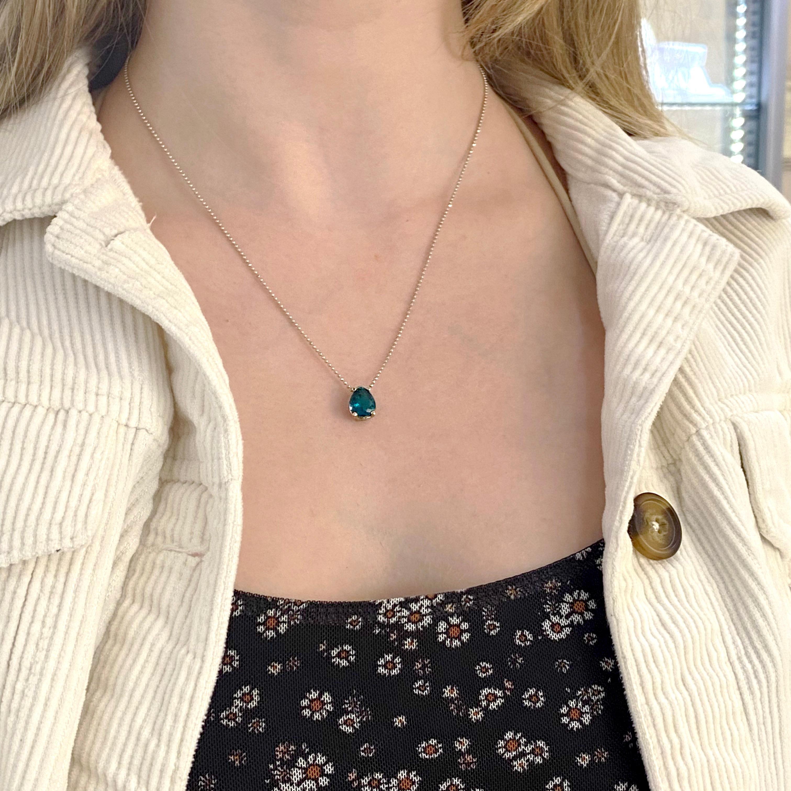 This teal colored apatite pendant and necklace is a spectacular gemstones with a truly unique color.  Many people have not heard of the apatite gem but its intensity of blue with a slight green color is highly desirable. This is a way to own a