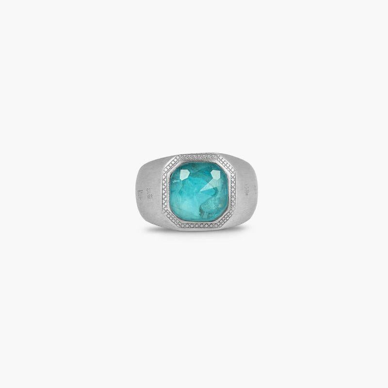 Apatite Signet Ring in Sterling Silver, Size L

A cabochon of crystal quartz is rose-cut and placed on a slice of apatite, cleverly combined to create a 'doublet', all expertly cut in Jaipur India. This unusual combination of semi-precious, faceted