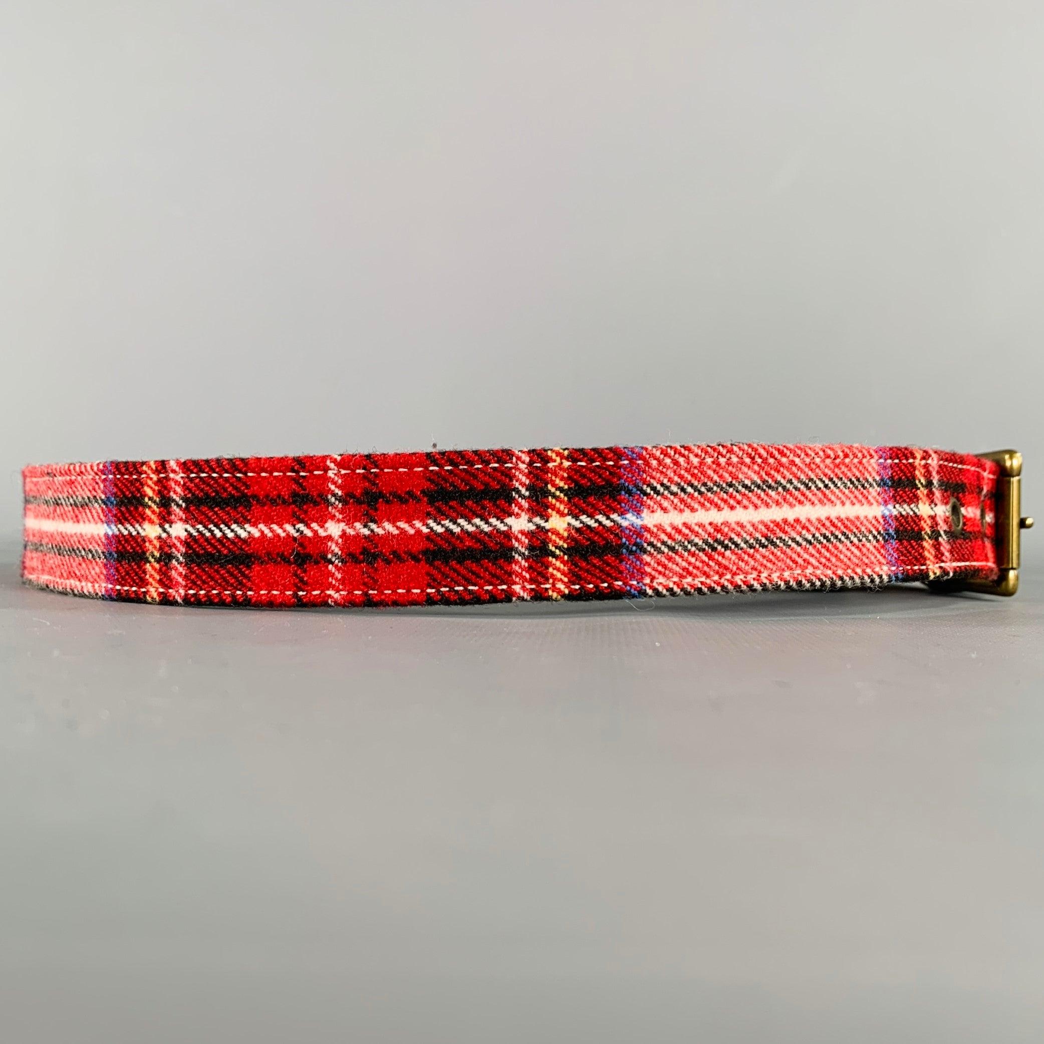 A.P.C.
belt in a red, black, and white wool blend featuring a plaid pattern, and brass buckle. Comes with storage pouch. Made in France.Excellent Pre-Owned Condition. 

Marked:   85Length: 39 inches Width: 1 inches Fits: 32 inches  - 36 inches
