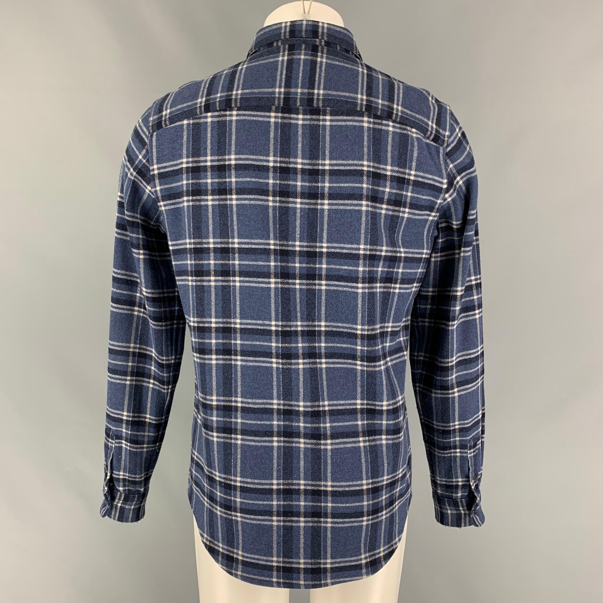 A.P.C long sleeve shirt comes in a blue & black plaid wool / nylon featuring a patch pocket, spread collar, and a button up closure. 

Very Good Pre-Owned Condition.
Marked: M
Original Retail Price: $136.00

Measurements:

Shoulder: 17.5 in.
Chest: