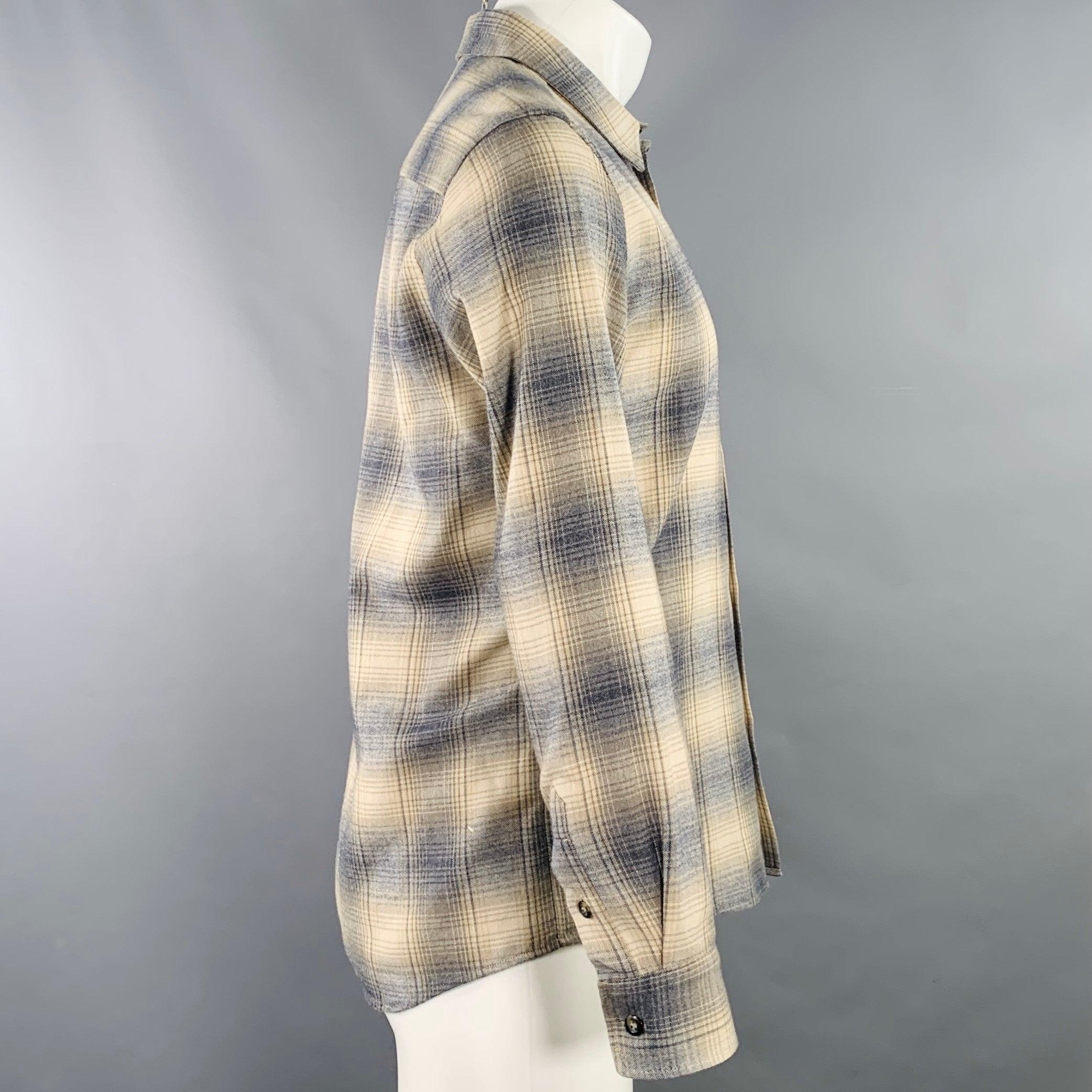 A.P.C. long sleeve shirt
in a beige, blue, and grey cotton woven fabric featuring a plaid pattern, one pocket, and button closure. Made in Romania.Excellent Pre-Owned Condition. 

Marked:   S 

Measurements: 
 
Shoulder: 16.5 inches Chest: 42 inches