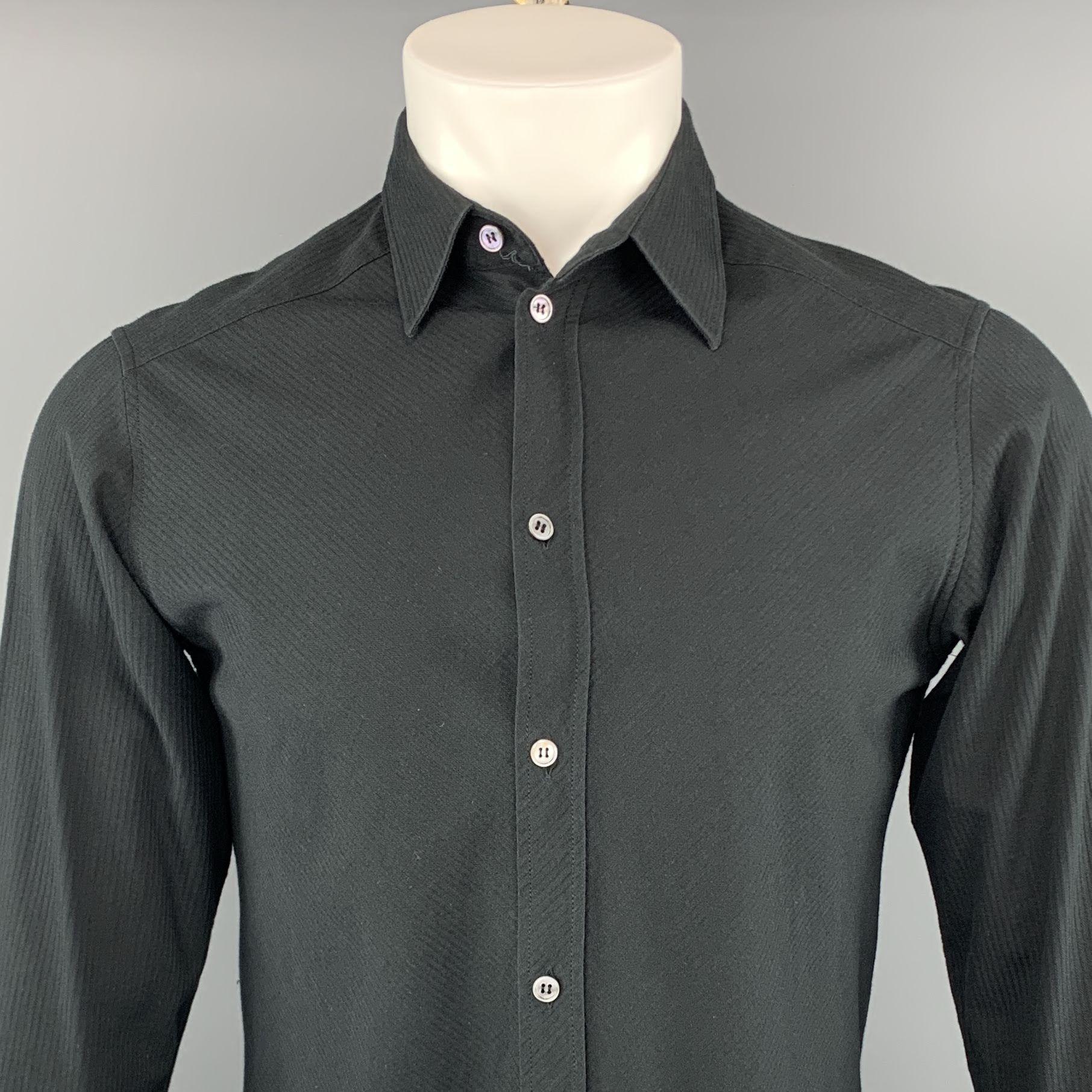 A.P.C long sleeve shirt comes in a black textured diagonal striped cotton featuring a button up stye and a spread collar.
 
Excellent Pre-Owned Condition.
Marked: 1
 
Measurements:
 
Shoulder: 16 in.
Chest: 41 in.
Sleeve: 26 in.
Length: 22.5 in.