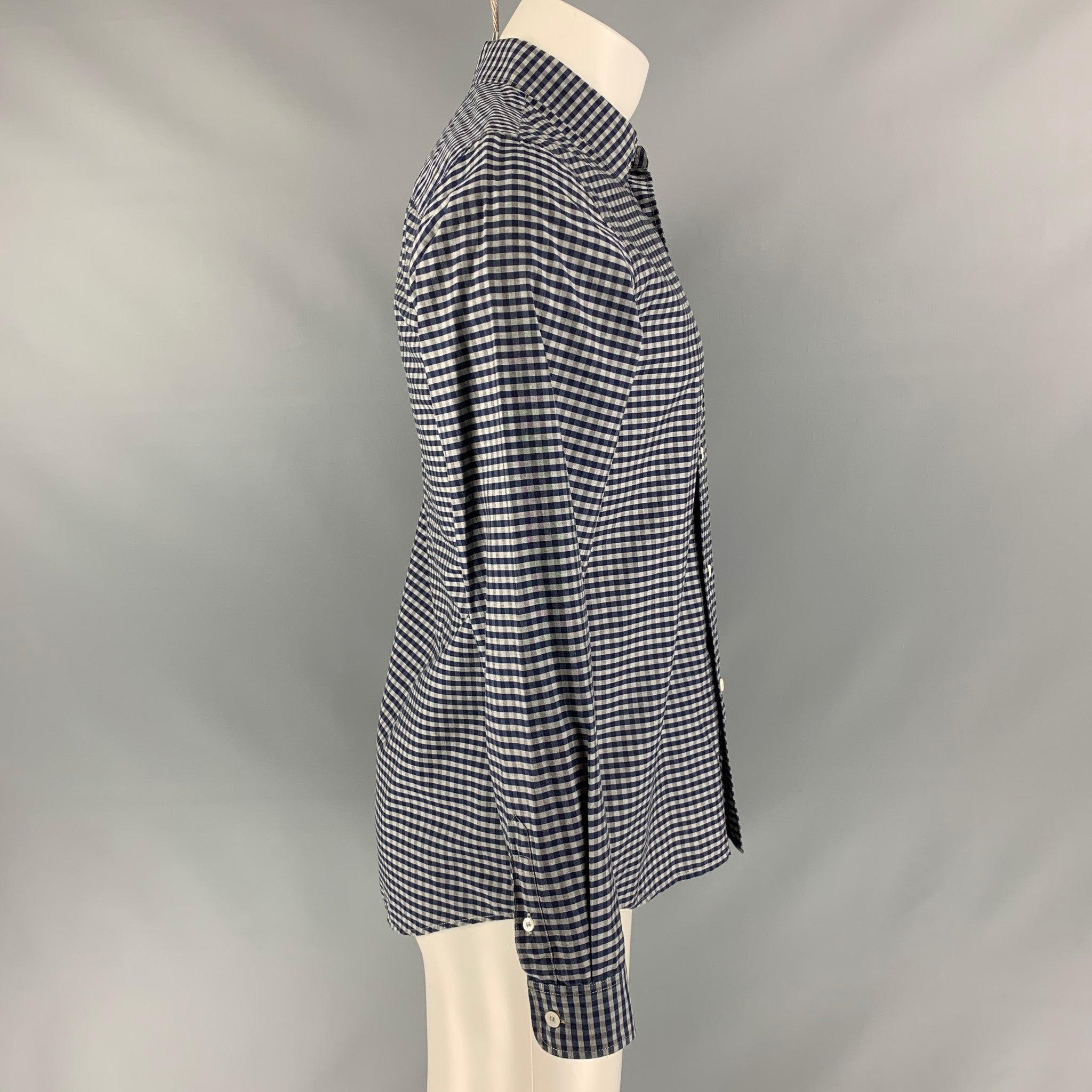 A.P.C. long sleeve shirt comes in blue and grey checkered cotton featuring a straight collar, buttoned closure and one button round cuff. Made in Tunisia.Excellent Pre-Owned Condition. 

Marked:   S 

Measurements: 
 
Shoulder: 17 inches Chest: 40