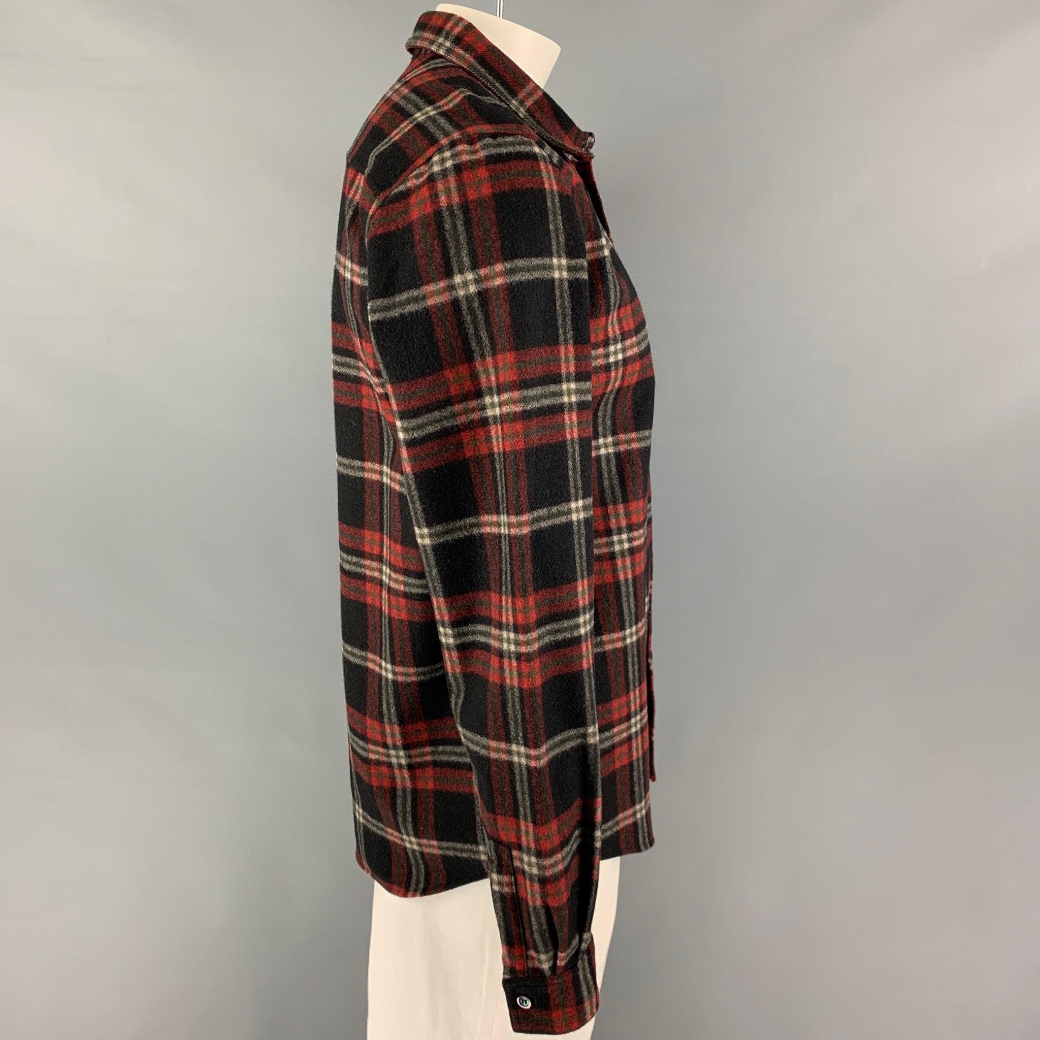 A.P.C long sleeve shirt comes in a black & red plaid wool /nylon featuring spread collar, patch pocket, and a button up closure.
Excellent
Pre-Owned Condition. 

Marked:   XL  

Measurements: 
 
Shoulder: 19 inches Chest: 44 inches Sleeve: 28 inches