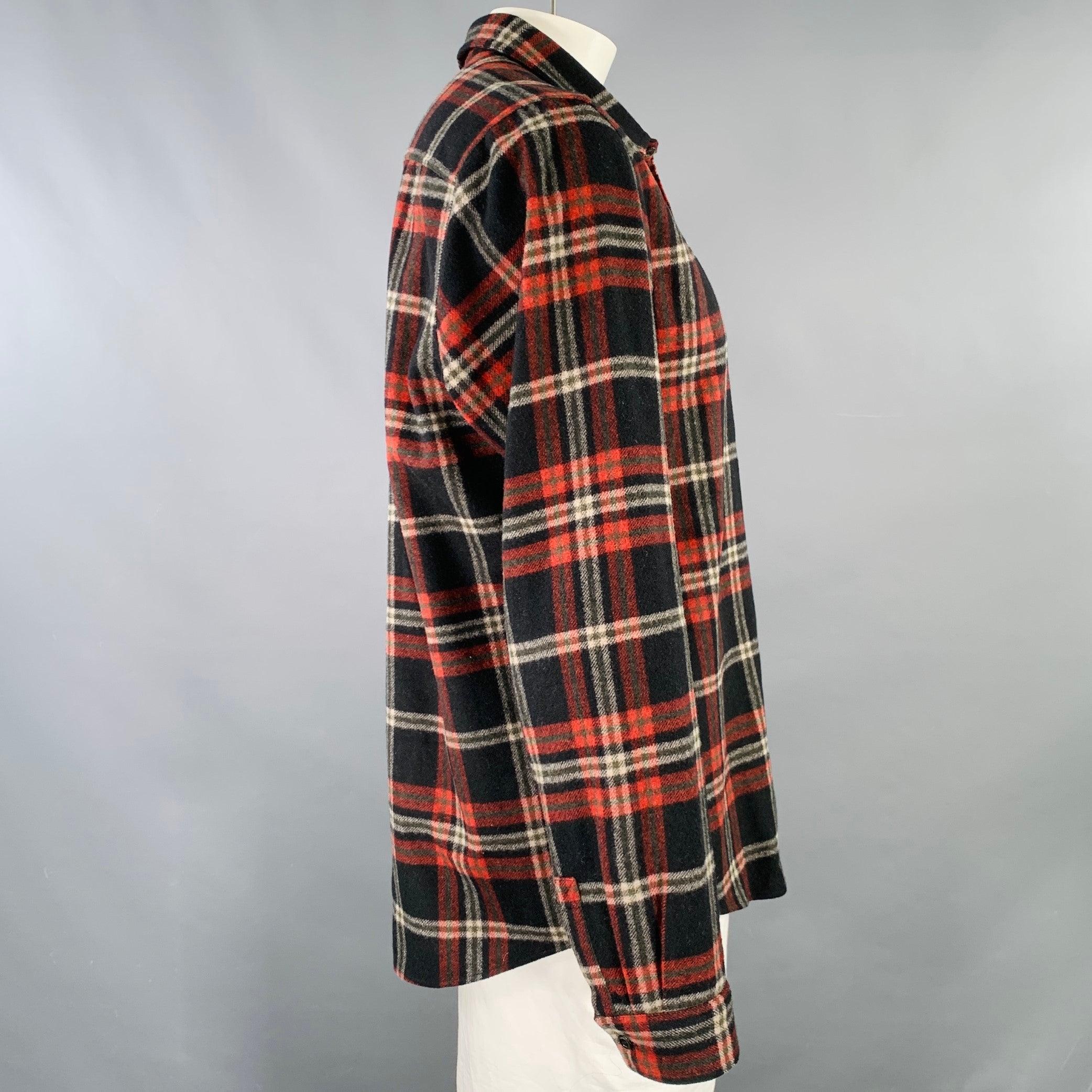 A.P.C. long sleeve shirt
in a black and red wool blend flannel featuring a plaid pattern, one pocket, and button closure. Made in Romania.Excellent Pre-Owned Condition. 

Marked:   XXL 

Measurements: 
 
Shoulder: 17.5 inches Chest: 47 inches
