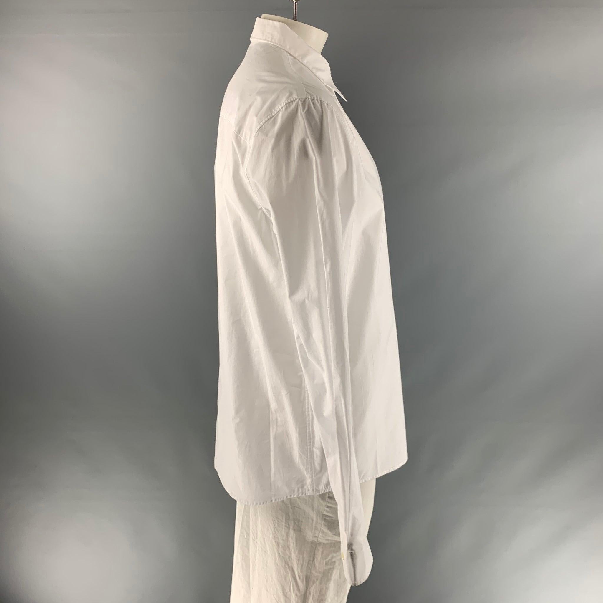 A.P.C. long sleeve shirt comes in a white cotton , featuring a classic fit, straight collar, and a button up closure.Very Good Pre-Owned Condition. 

Marked:   XXL 

Measurements: 
 
Shoulder: 19 inches Chest: 46 inches Sleeve: 27 inches Length: 33