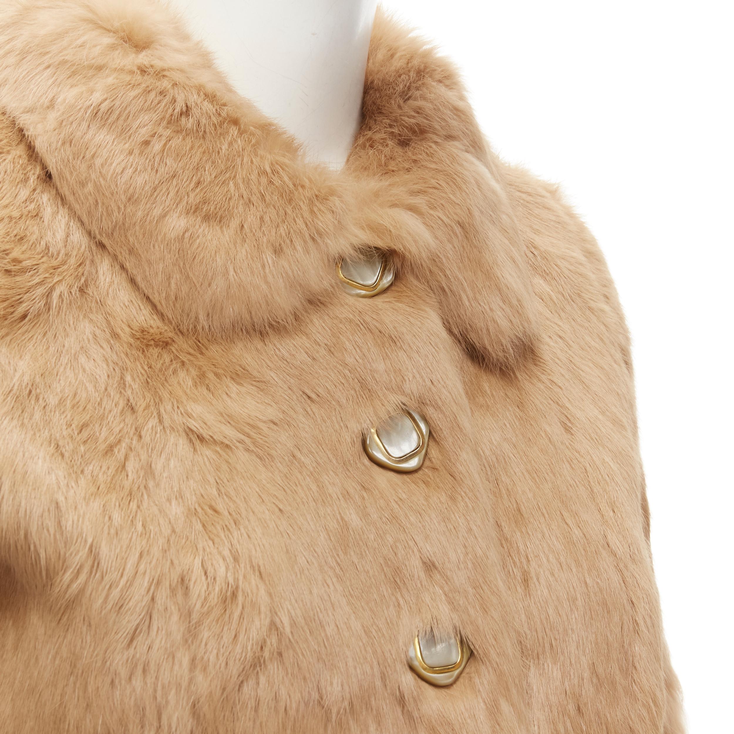 APC tan brown genuine fur gold-tone buttons winter coat jacket XS
Reference: YNWG/A00165
Brand: A.P.C.
Material: Fur
Color: Brown
Pattern: Solid
Closure: Button
Lining:  Fabric
Made in: China

CONDITION:
Condition: Excellent, this item was pre-owned