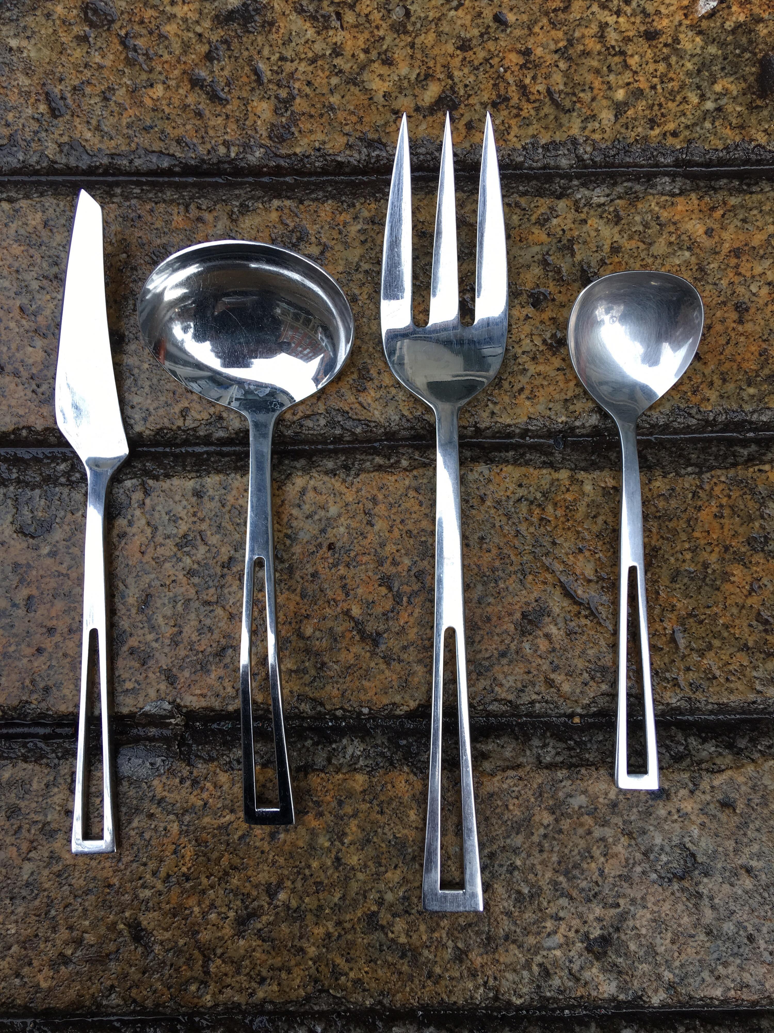 Aperto flatware by Jorgen Dahlerup for Supreme five piece place settings for 12 with butter knife, ladle, serving fork and sugar spoon 64 in total. Each pieces incised with name.