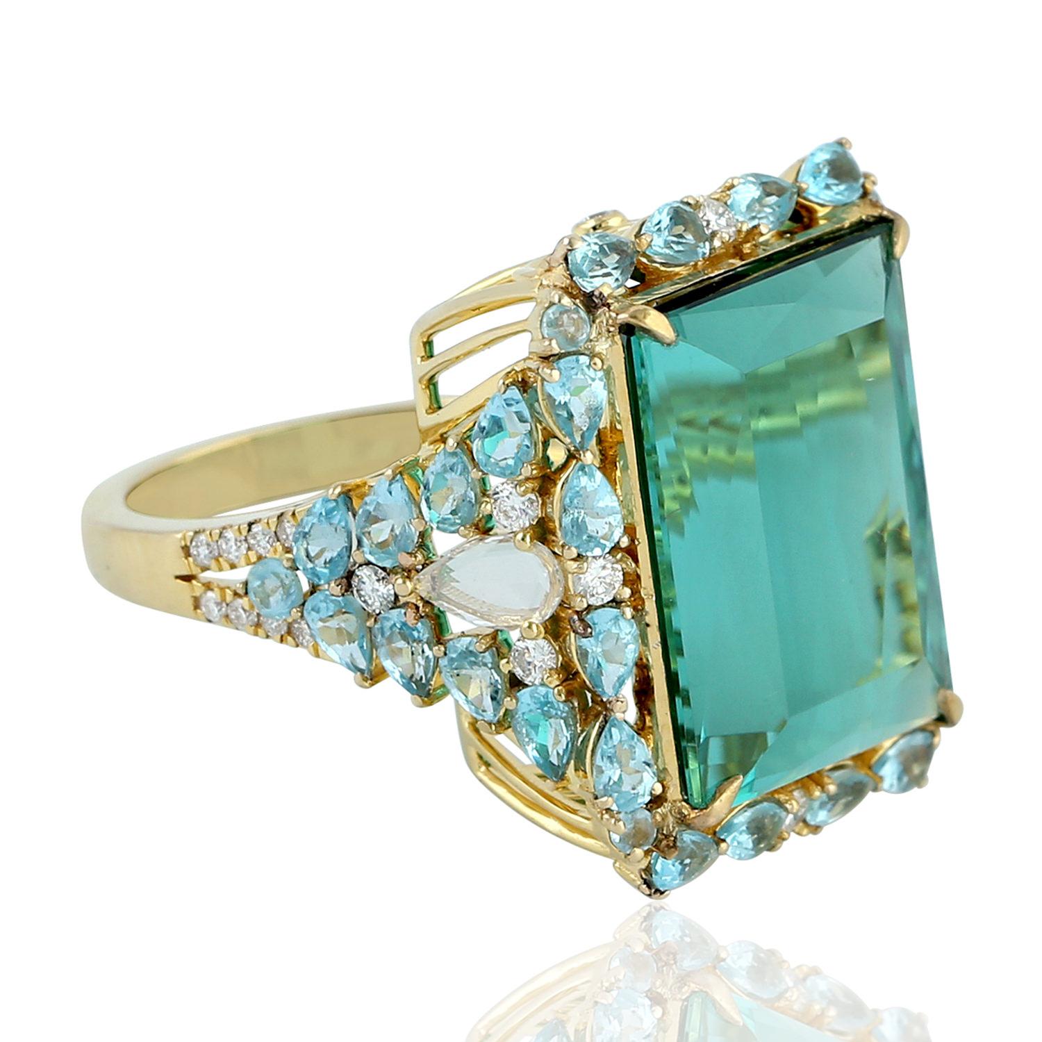 Beautiful Apetite Tourmaline and Diamond Ring set in 18K Yellow Gold. This ring is truly special as the blue color of tourmaline is so rare with brilliant princess cut.

Ring Size: 7  ( can be sized )

18KT: 7.507gms
Diamond: 0.49cts
APETITE: