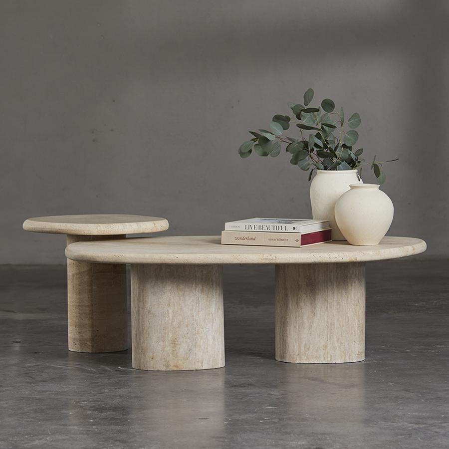 Apfel Side Table is a sculptural accent piece that translates the bold presence of the Apfel collection into a more compact scale. Its form balances solidity and refinement, offering a grounded silhouette that complements a wide range of