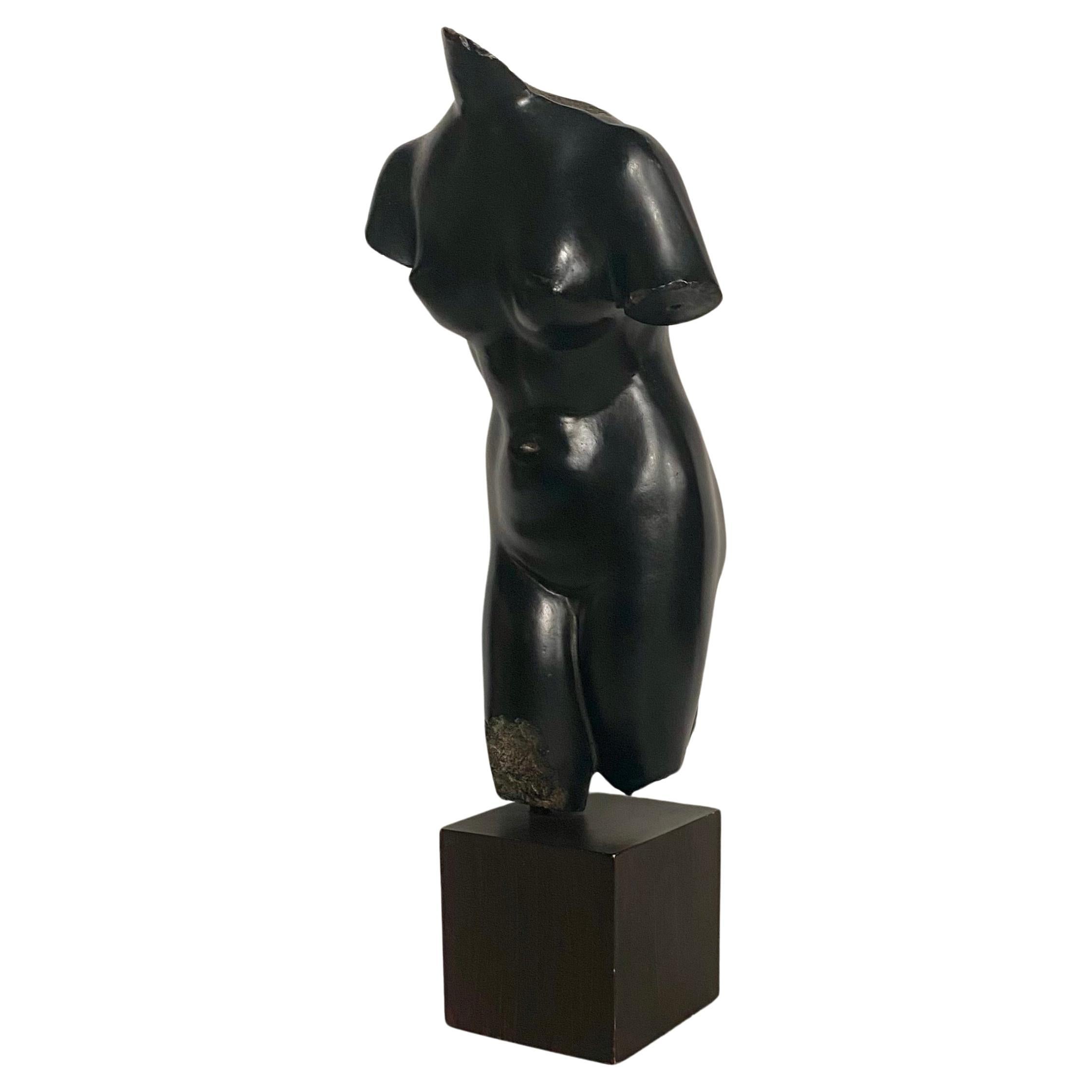 Fabulous reproduction cast resin sculpture of Aphrodite from The Metropolitan Museum of Art, NYC.  This classical figural sculpture features a black finish and is mounted on a square wood grain plinth base.  Original museum label to underside of