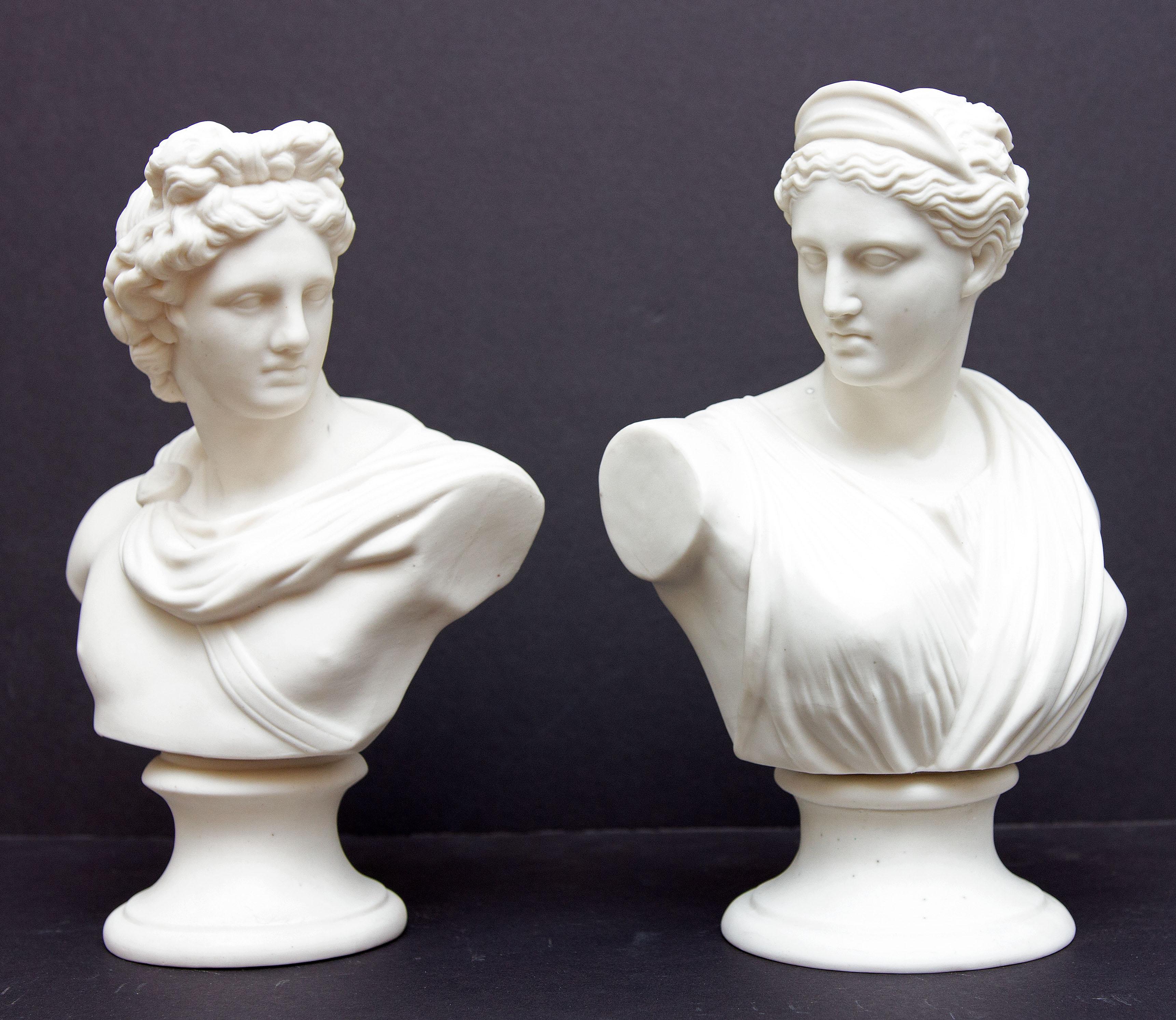 Pair of classical busts. Apollo and Diana. Parian bisque. Early 20th century.