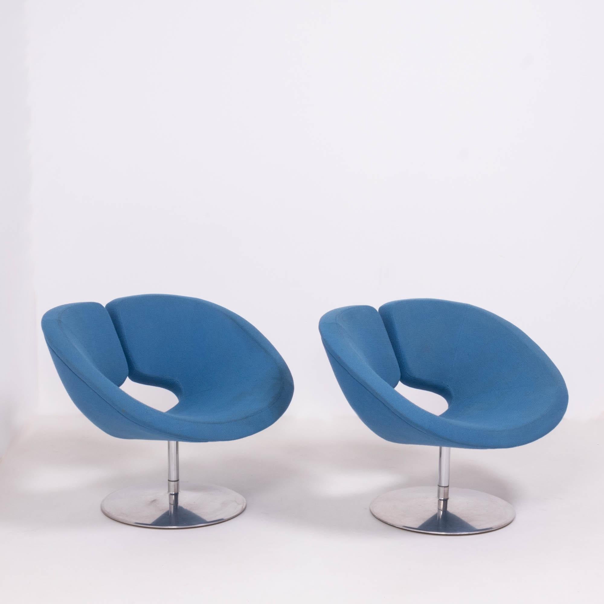 Originally designed in 2002 by Patrick Norguet for Artifort, these Apollo armchairs are a bold example of modern design.

The armchairs have a wide, sculptural form, creating a comfortable seat upholstered in a bright blue fabric.

They sit on