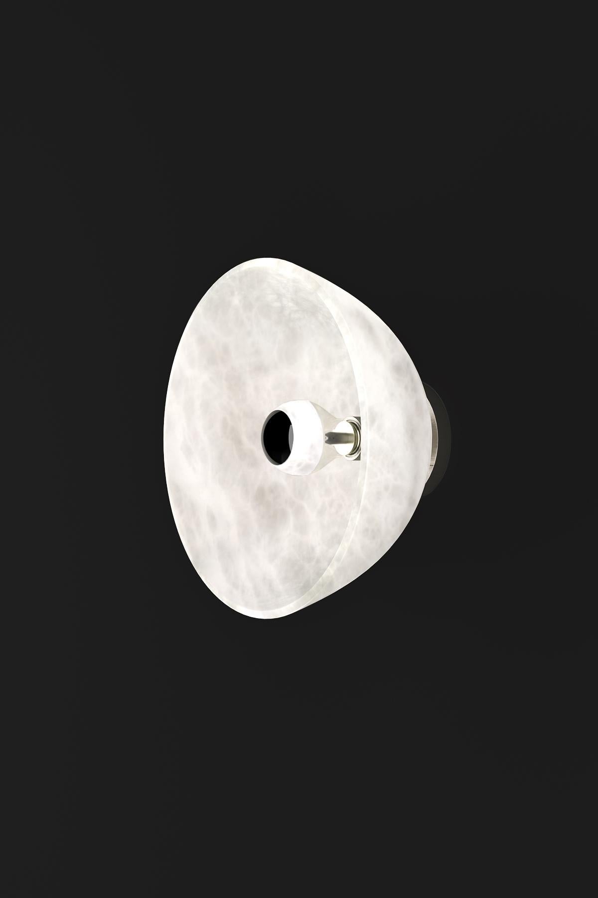 Apollo Brushed Metal Wall Lamp by Alabastro Italiano
Dimensions: Ø 30 x W 17,5 cm.
Materials: White alabaster and metal.

Available in different finishes: Shiny Silver, Bronze, Brushed Brass, Ruggine of Florence, Brushed Burnished, Shiny Gold,