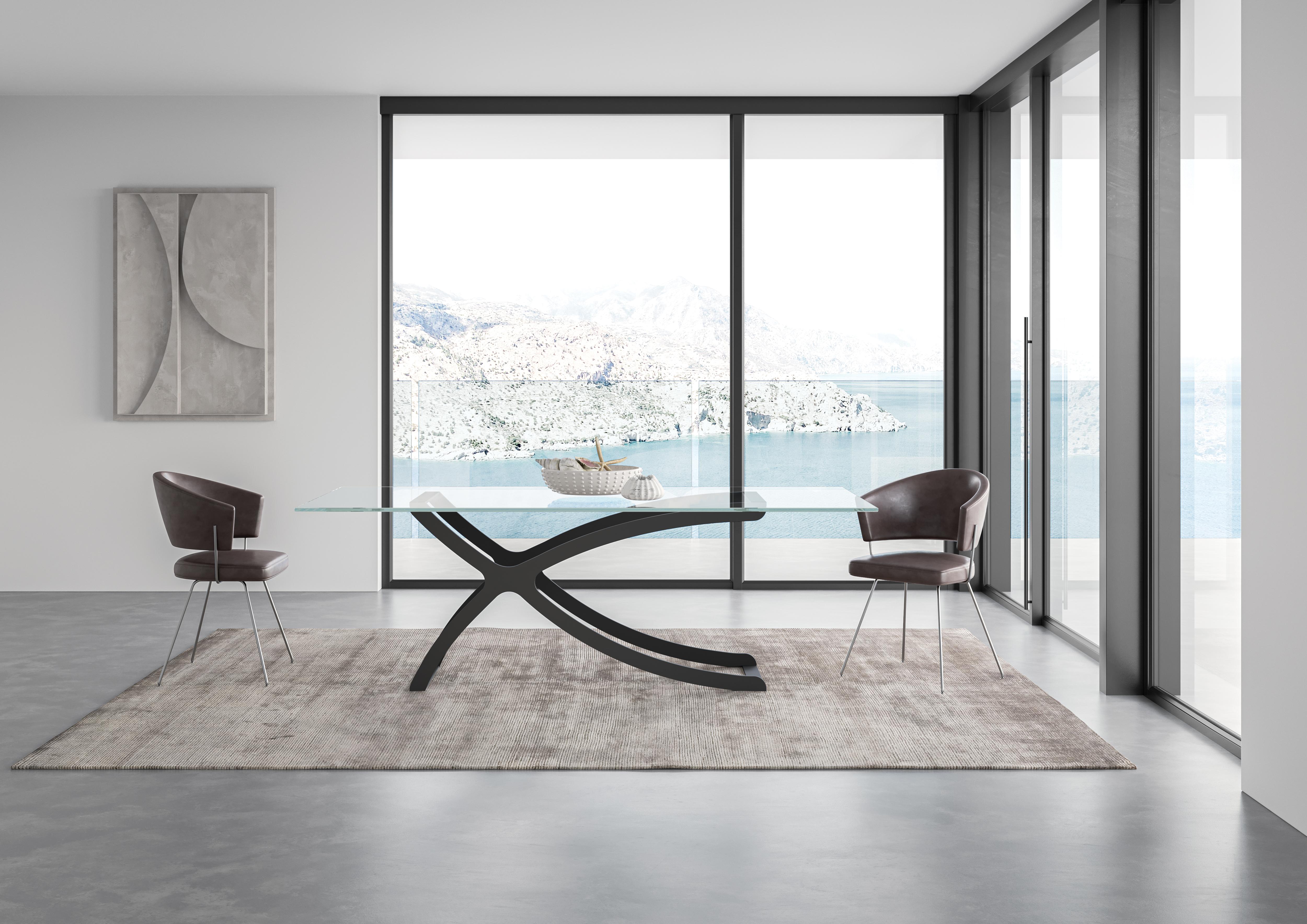 Apollo Dining Table by Chinellato Design
Dimensions: W 250 x D 120 x H 72 cm
Materials: Top: Extra Clear Tempered Glass
Base: Matte Black Varnished

The base, crafted from worked and welded steel, is available in Chabin Gold or Matte Black Paint