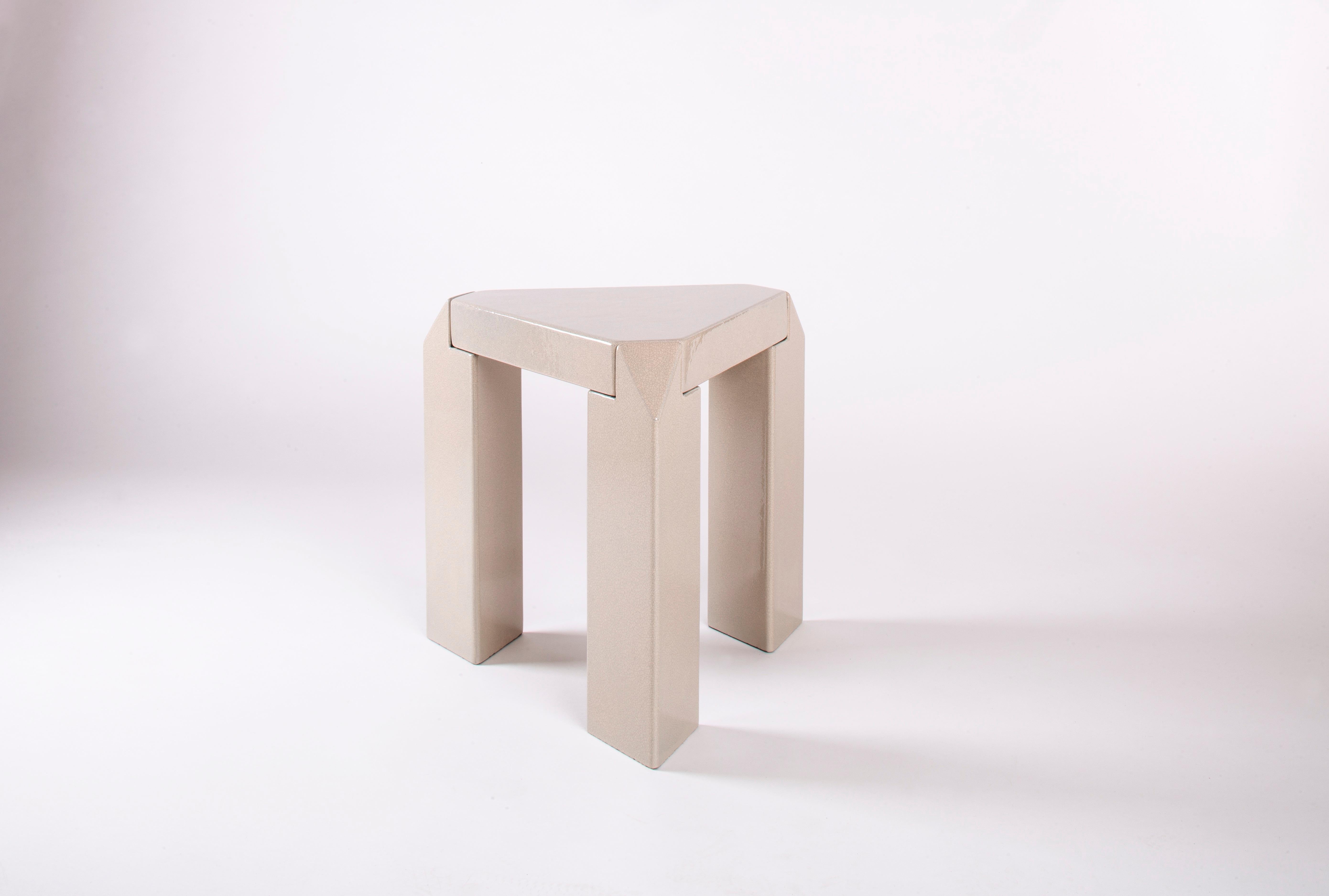 This artisanal, hand-crafted collectible side table, finished with a refined crackled surface, is a thoughtful exploration of simplicity, proportion, architectural tectonics, and materiality. Every element of its design is carefully considered,