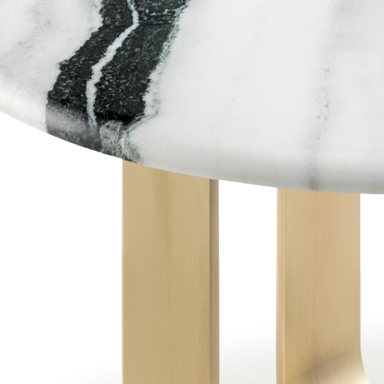 A striking juxtapositions of natural materials and unique colour combinations, Apollo side table will play a starring role in your living room. Fashioned from satin Dalmata marble, the table top is adorned by a round inlay in Corno Italiano with