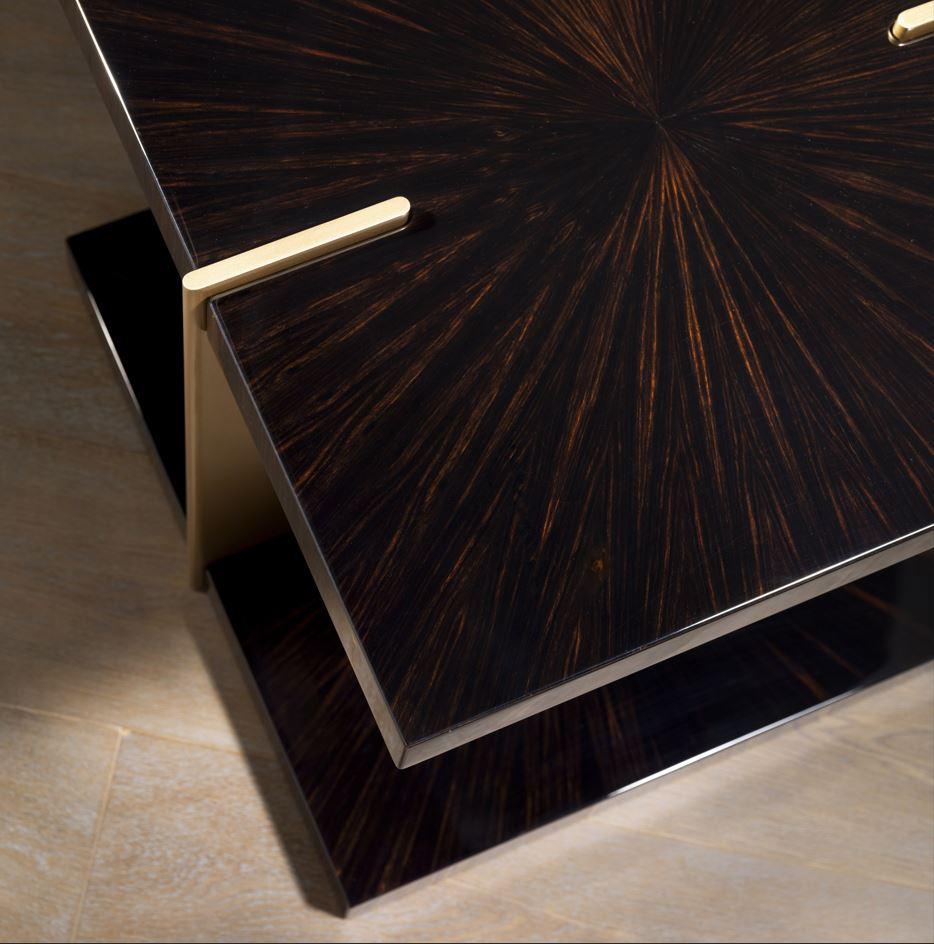 The APOLLO coffee table is the centerpiece of this room. With its elegant aluminum structure in luxurious gold and the glossy tabletop made of ebony, it captures all attention. It tells stories of exquisite design and craftsmanship that are palpable