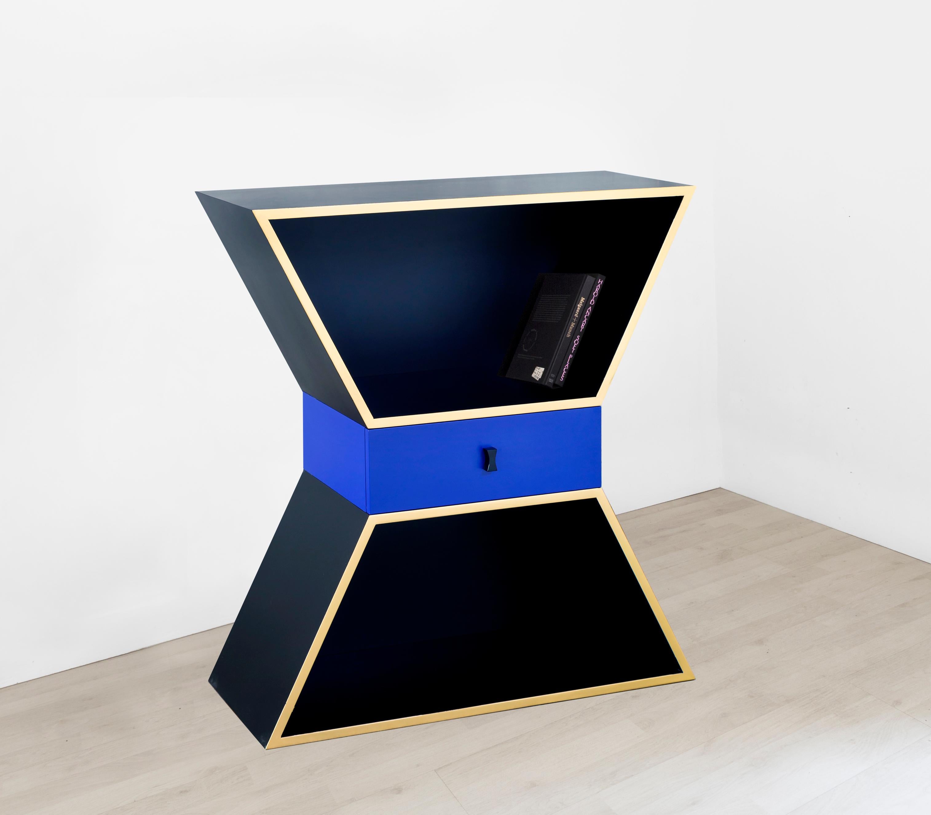 Apollon is a sculptural storage cabinet designed from an hourglass shape. The chromatic balance of this piece of furniture with an Art Deco style is contrasted by the central drawer to create a new harmony of colors.

Apollon is a sculptural storage