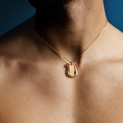 Apollo’s Lyre Pendant, 18-carat pink gold, rubies and diamonds