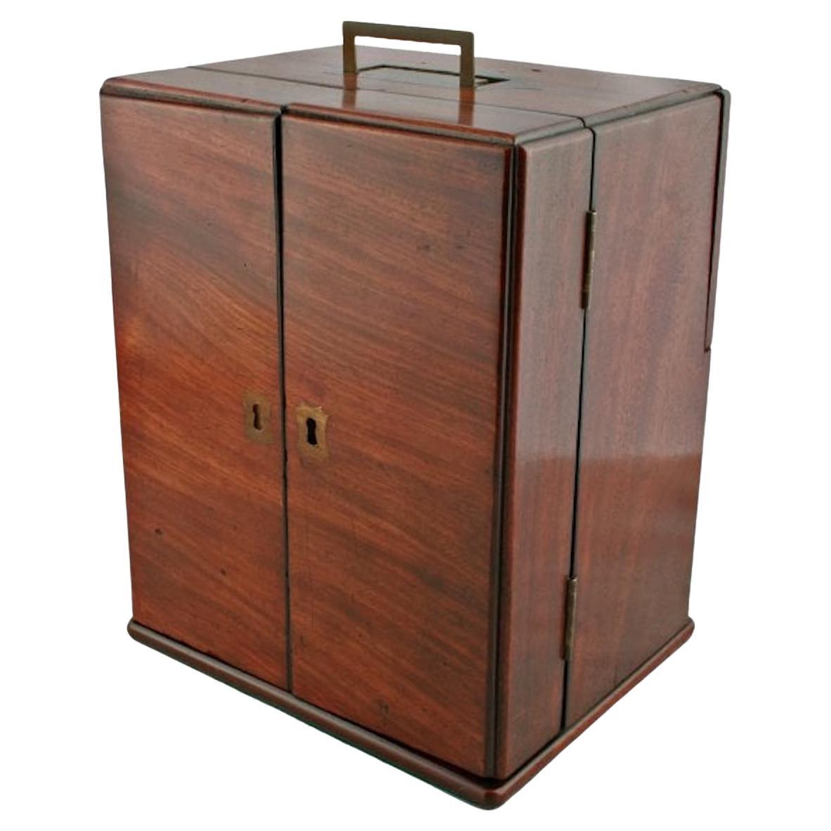 George III Apothecary cabinet

A George III mahogany apothecary cabinet.

The box has a brass military late handle set in the top and comprises a pair of doors that open and have space for six bottles.

The interior can hold four bottles and