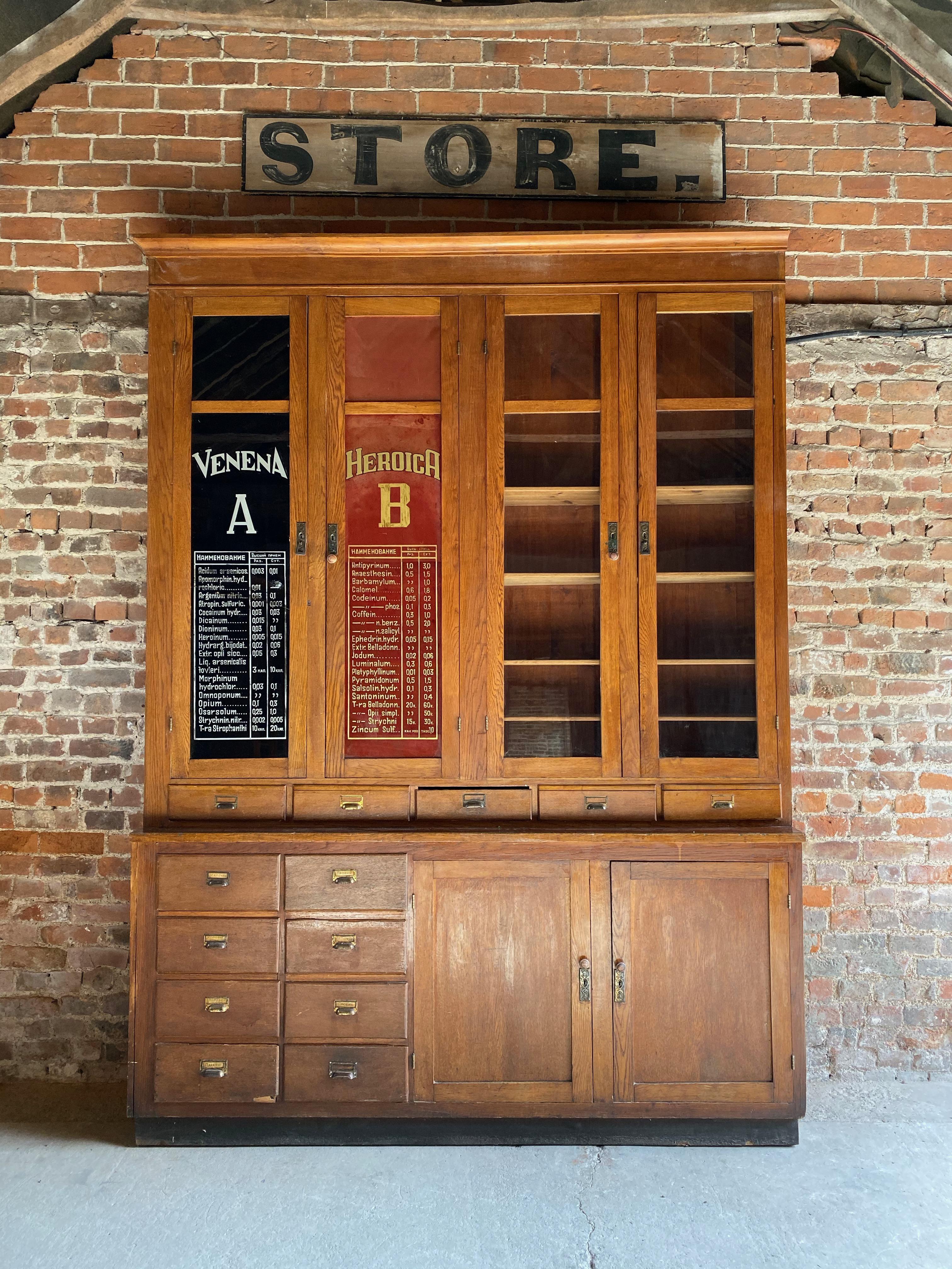 Monumental 9ft tall Apothecary dispensing cabinet circa 1920s number 4

Huge 9ft tall Apothecary oak pharmacists dispensing cabinet dating to circa 1920s, This piece is one of six similar pieces all from the same pharmacy, the upper section with a