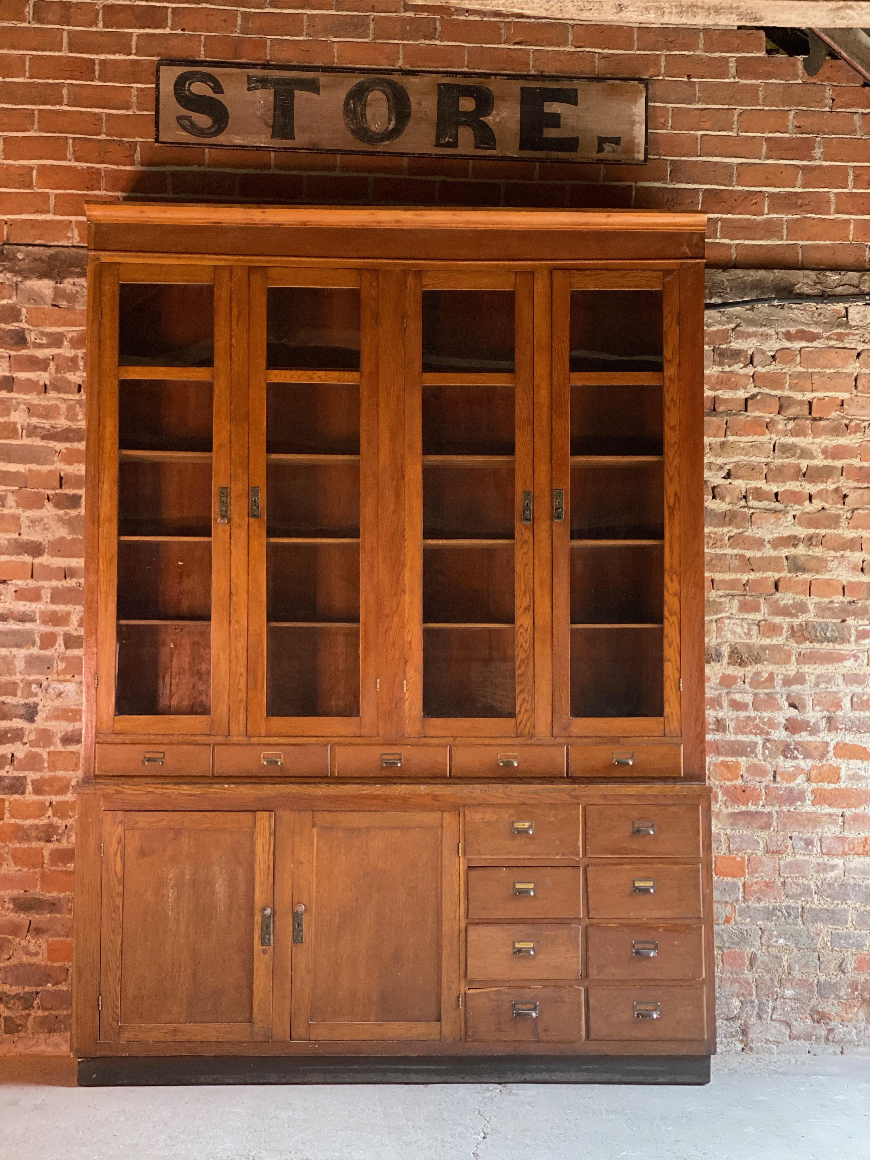 Monumental 9ft tall apothecary dispensing cabinet circa 1920s number 5

Huge 9ft tall apothecary oak pharmacists dispensing cabinet dating to circa 1920s, This piece is one of six similar pieces all from the same pharmacy, the upper section with a