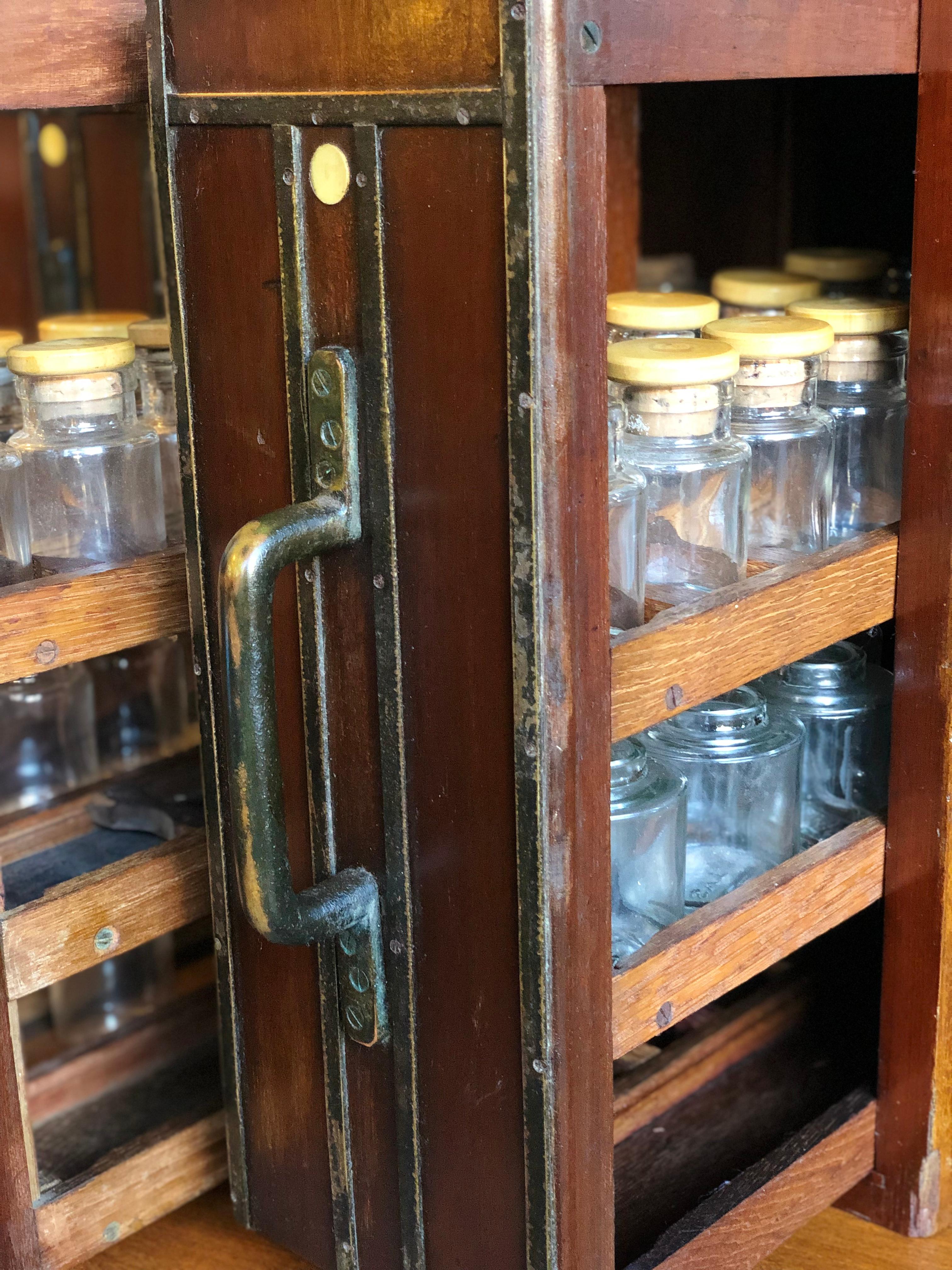 Apothecary Cabinet, Early 20th Century, Vertical Drawers with 113 Glass Bottles 11