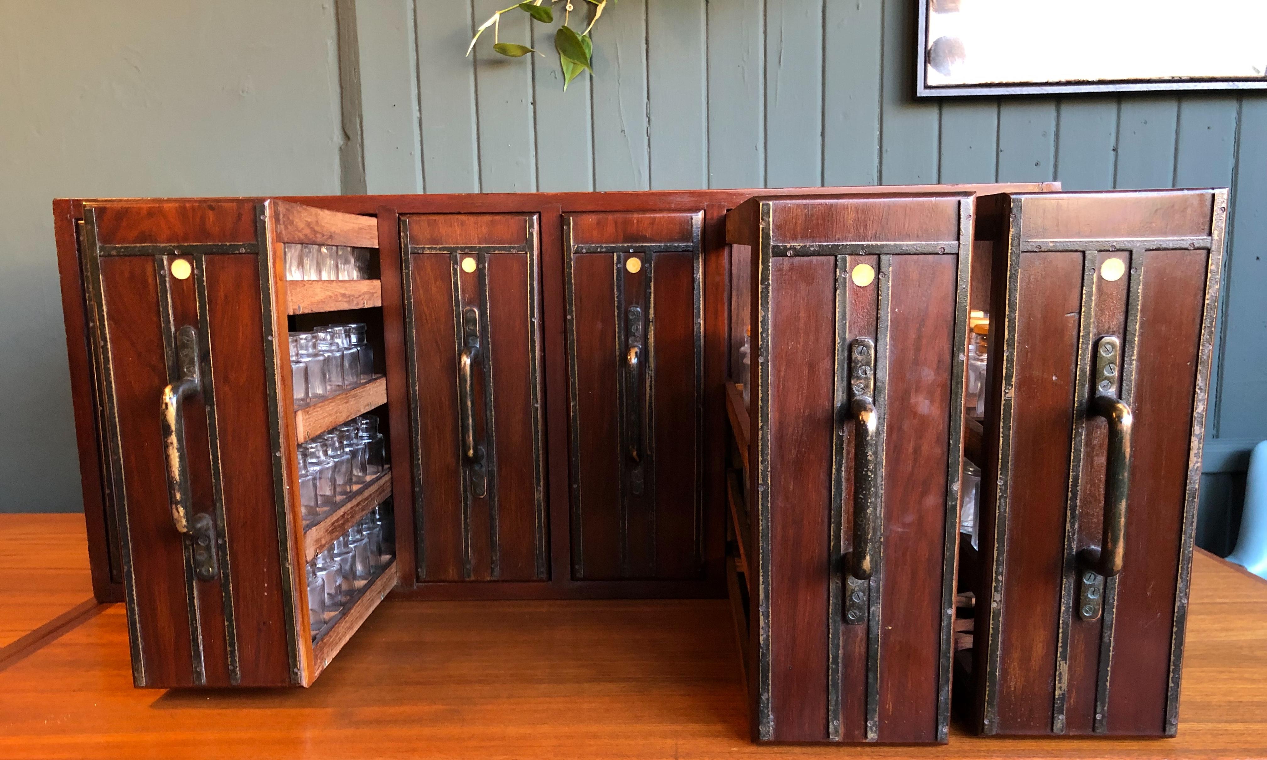 Apothecary Cabinet, Early 20th Century, Vertical Drawers with 113 Glass Bottles In Good Condition In London, GB