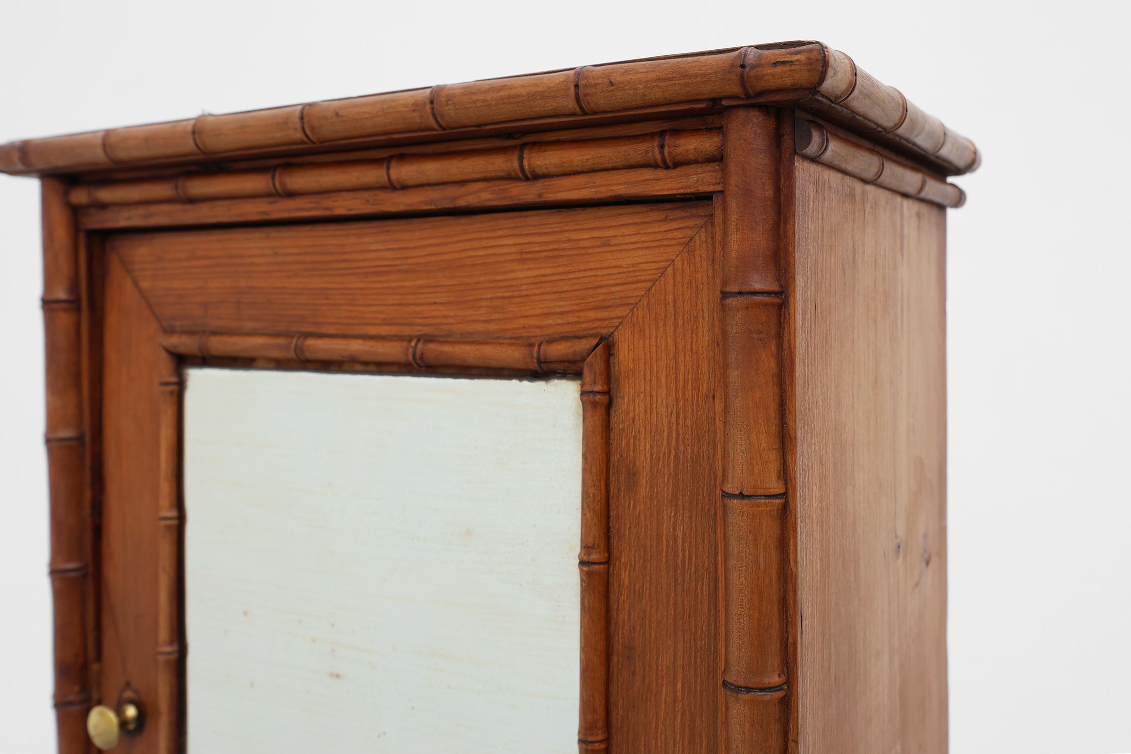 French Provincial Apothecary cabinet in faux bamboo with mirror and drawer, France 1900s For Sale