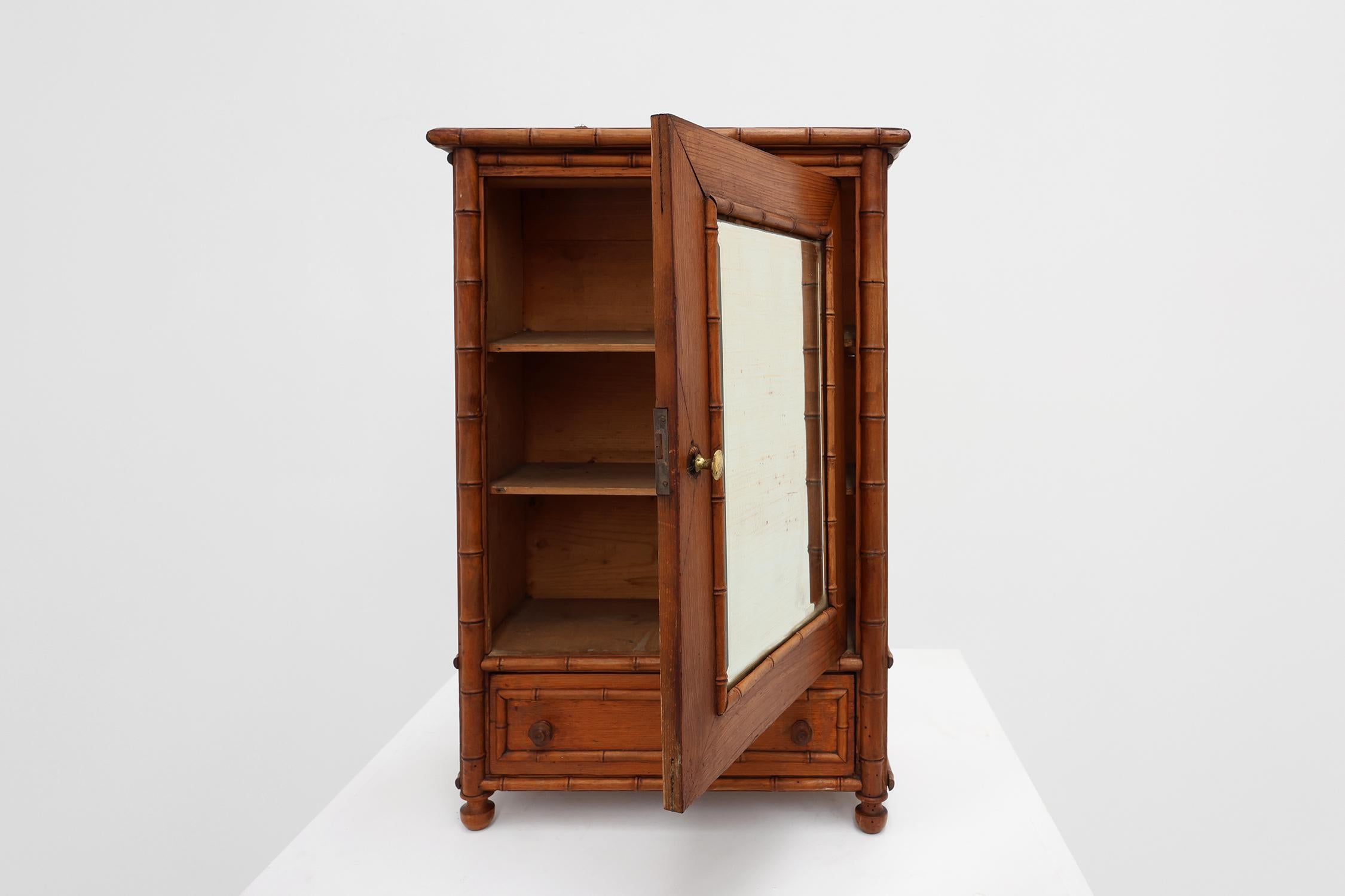 20th Century Apothecary cabinet in faux bamboo with mirror and drawer, France 1900s For Sale