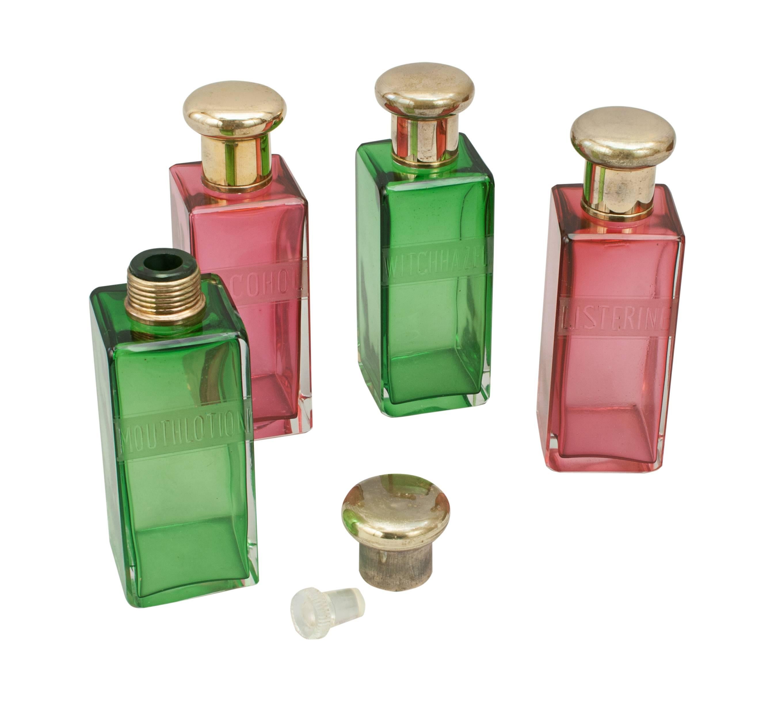 Colored remedy bottles in leather case.
Set of four vanity, toiletry, medicine glass bottles in a brown leather case. The case is fitted with a brass 'tuck-tite' clasp lock, U.S.A pat. 159C4OC, Worlds Pat's, Patent Brevete. The leather embossed