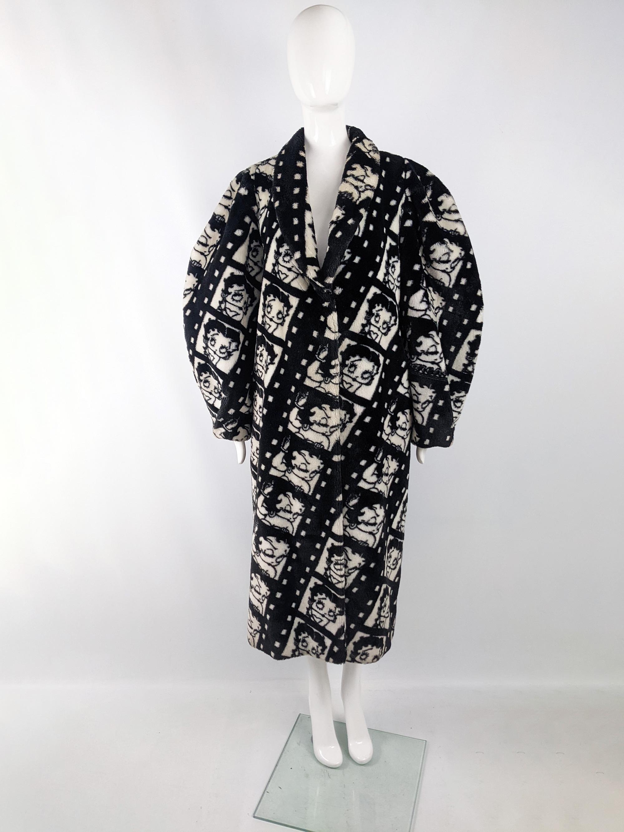 An absolutely incredible and rare vintage womens maxi coat from the 80s by luxury French fashion house, Apparence (best known for their Disney faux fur coats, but we've never seen another Betty Boop one). In a black and white faux fur with Betty
