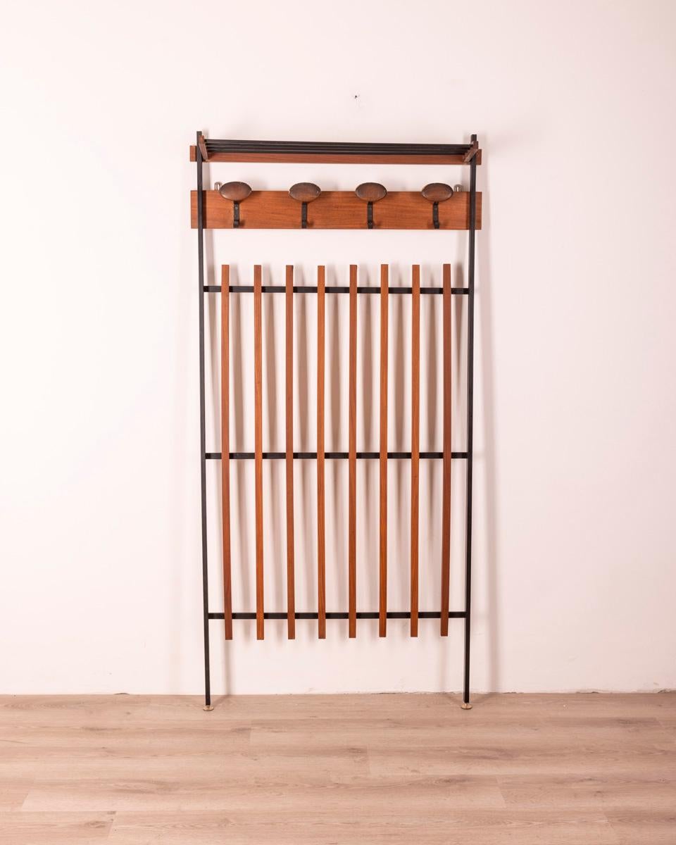 Wall-mounted coat rack with black metal and wood frame, golden brass adjustable feet, Italian design, 1960s.

CONDITION: In good condition, shows signs of wear given by time.

DIMENSIONS: Height 182 cm; Width 90 cm; Length 25 cm

MATERIAL: Metal and