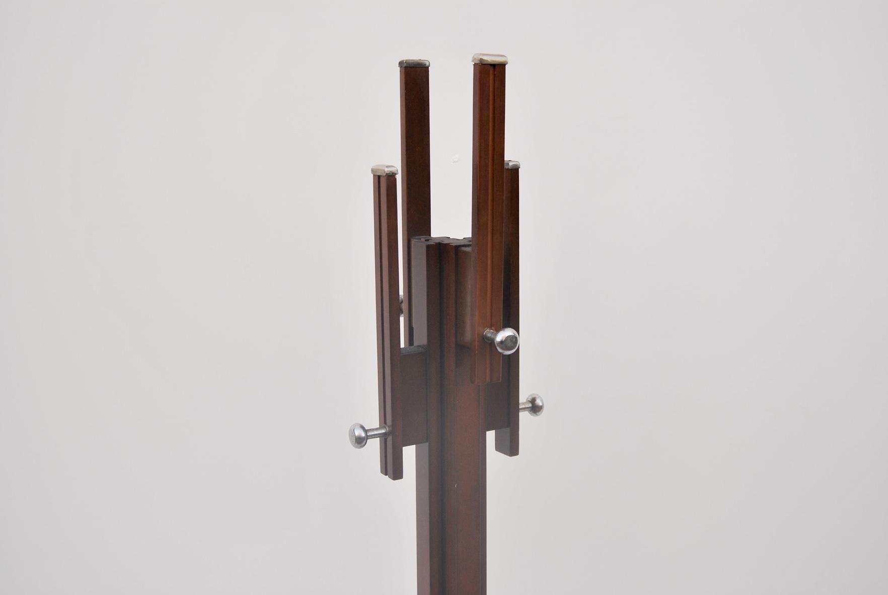 Coat stand designed by Carlo De Carli for Fiam, 1960s. 
The frame is made of wood with chrome-plated steel trim. 
Condition is perfect, some slight signs of use due to time.  
The price of shipping is for the Italian territory, for the islands and
