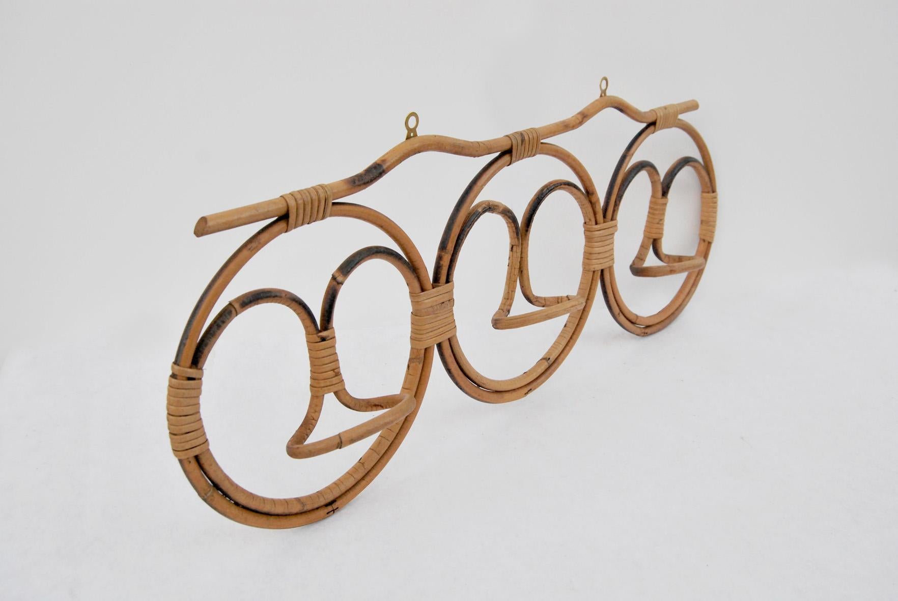 Rattan coat rack, 1970s. 
Condition is excellent, some slight signs of use due to time. 
The price of shipping is for the Italian territory, for the islands and for shipping abroad quote on request. 
Customs expenses are to be paid by the recipient.