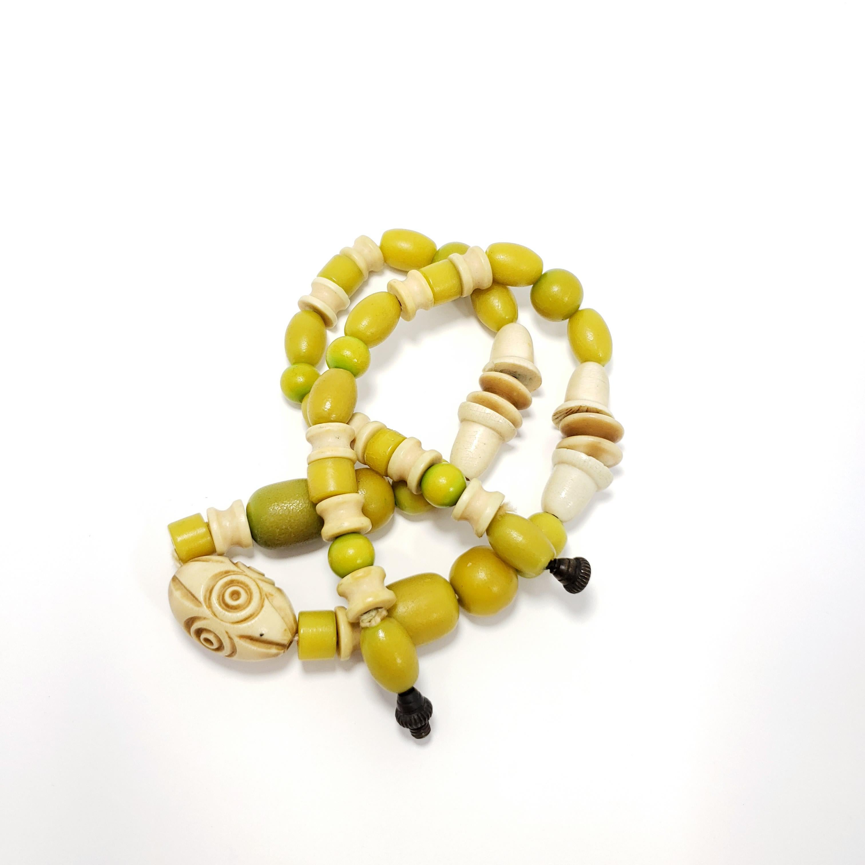 Retro Apple Green and Cream Colored Carved Bakelite Bead Necklace, Brass Tone Clasp For Sale
