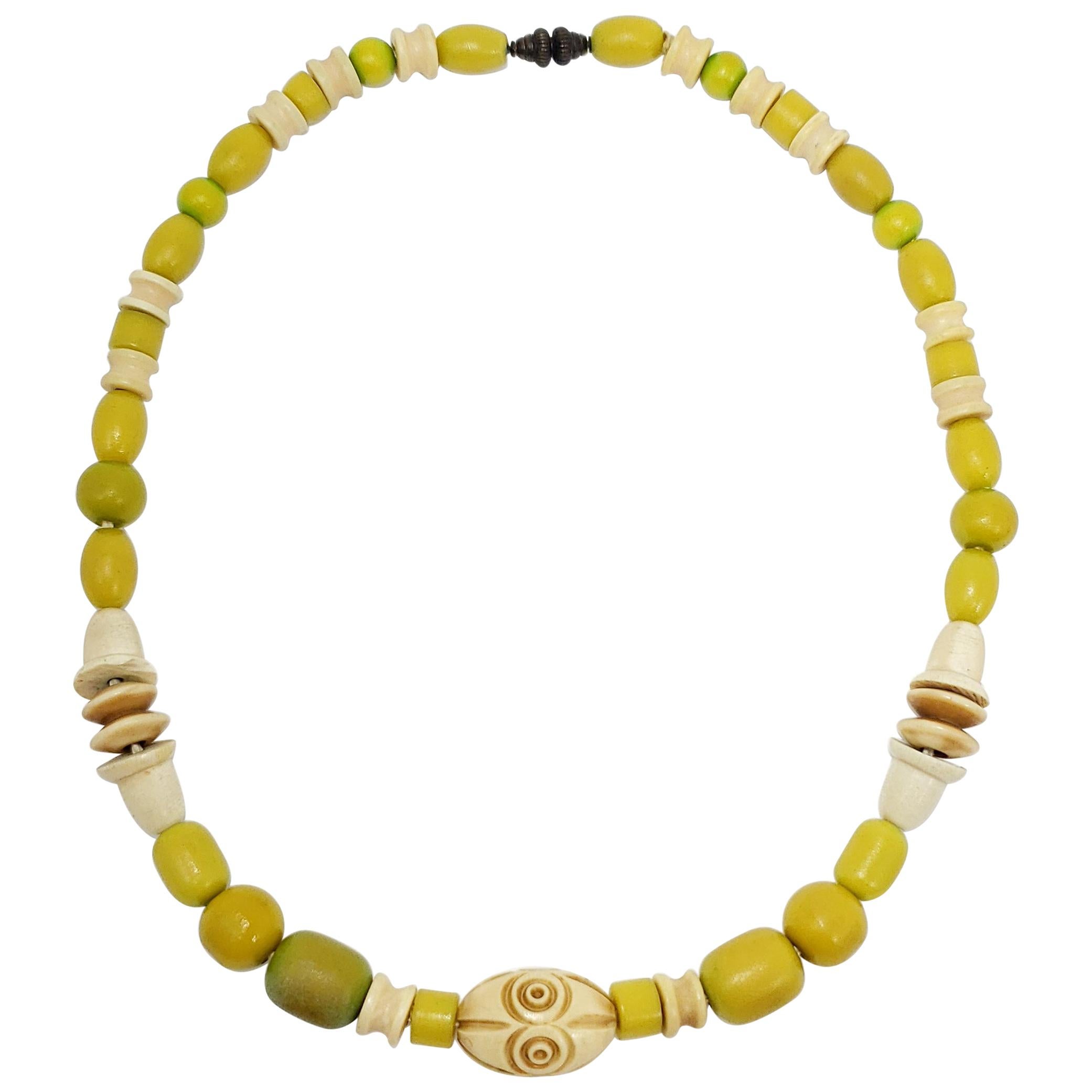 Apple Green and Cream Colored Carved Bakelite Bead Necklace, Brass Tone Clasp For Sale