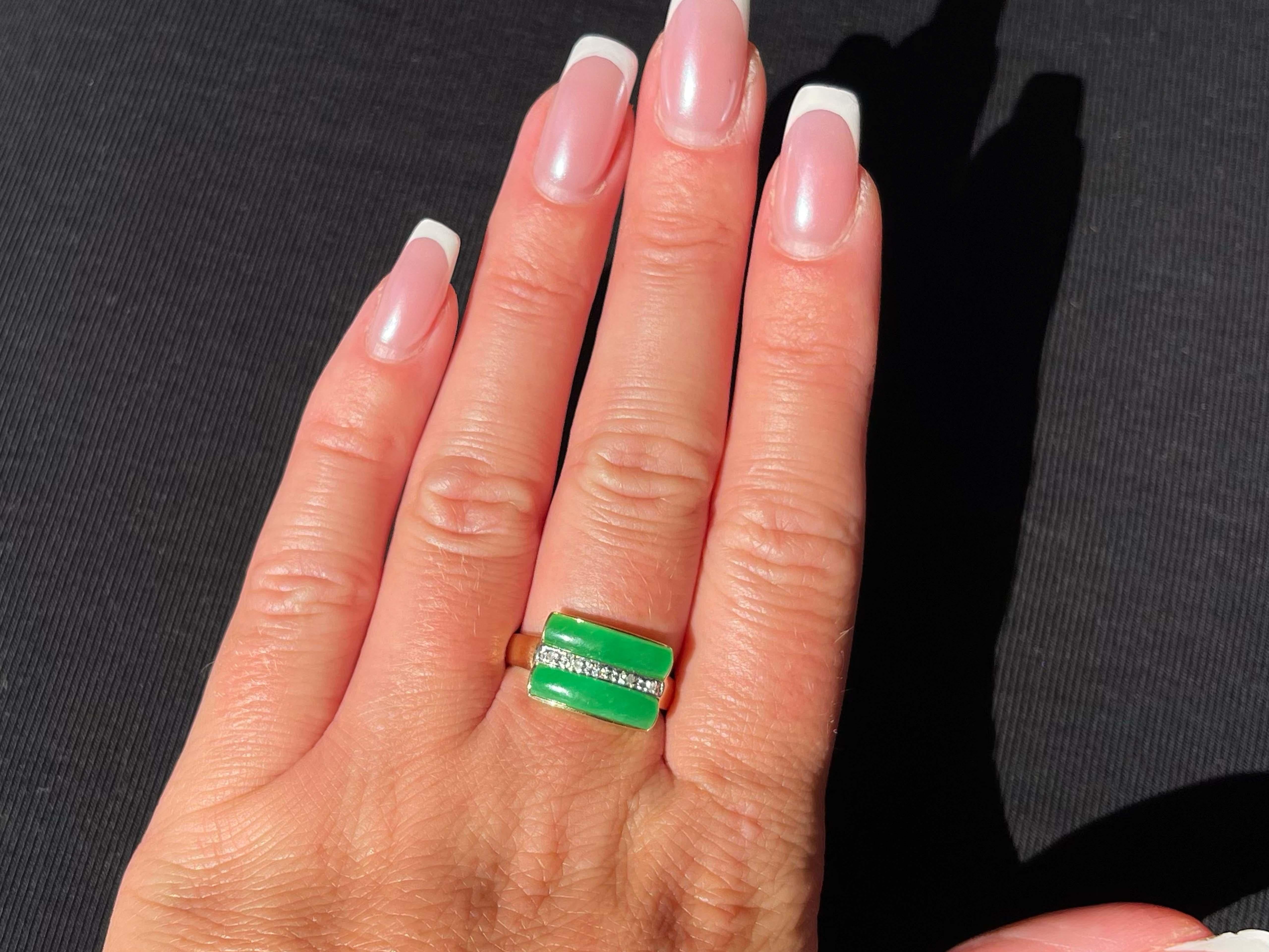 Item Specifications:

Metal: 14K Yellow Gold 

Style: Statement Ring

Ring Size: 7.75 (resizing available for a fee)

Total Weight: 2.9 Grams

Gemstone: Jadeite Jade

Ring Measurements: 15 mm x 10 mm 

Diamond Count: 5 round brilliant 

Condition: