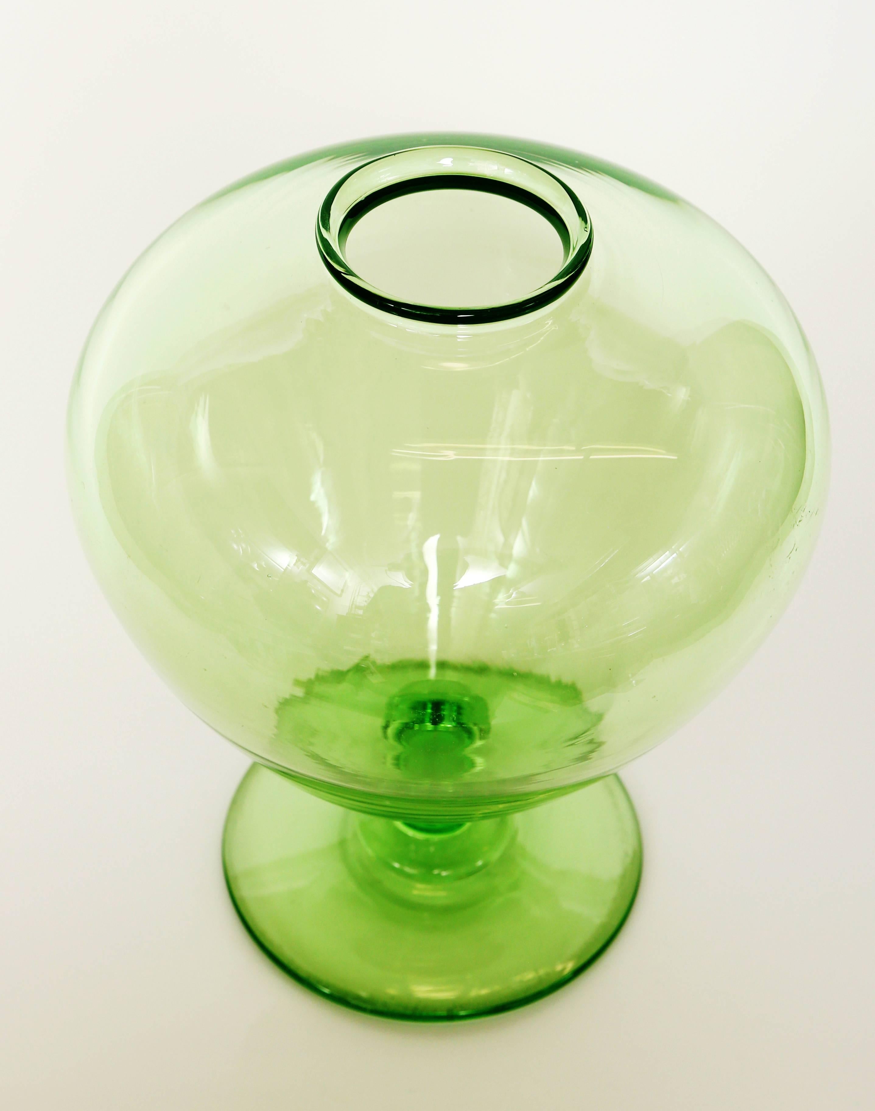 This beautiful apple green vase was hand blown in the Venetian style.   The bulbous form has a narrow neck,  stem and foot with a polished pontil on the underside.  Due to the short duration of production Union Glass is desirable to collectors and