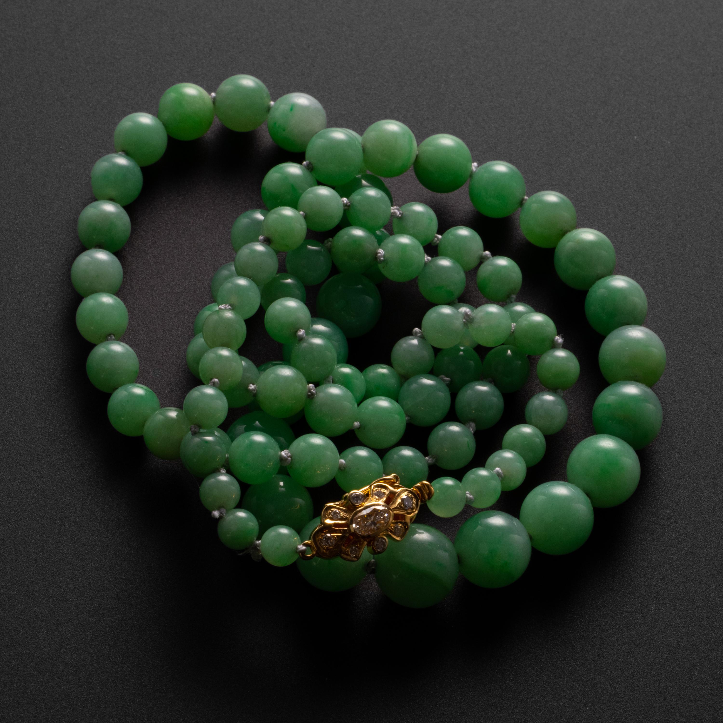 Rarely -if ever- have I come across a light apple-green jadeite necklace with such a fine grain and evenness of tone. The highly translucent beads have such a high polish and pure, even tone, that it seems both amazing and impossible that these