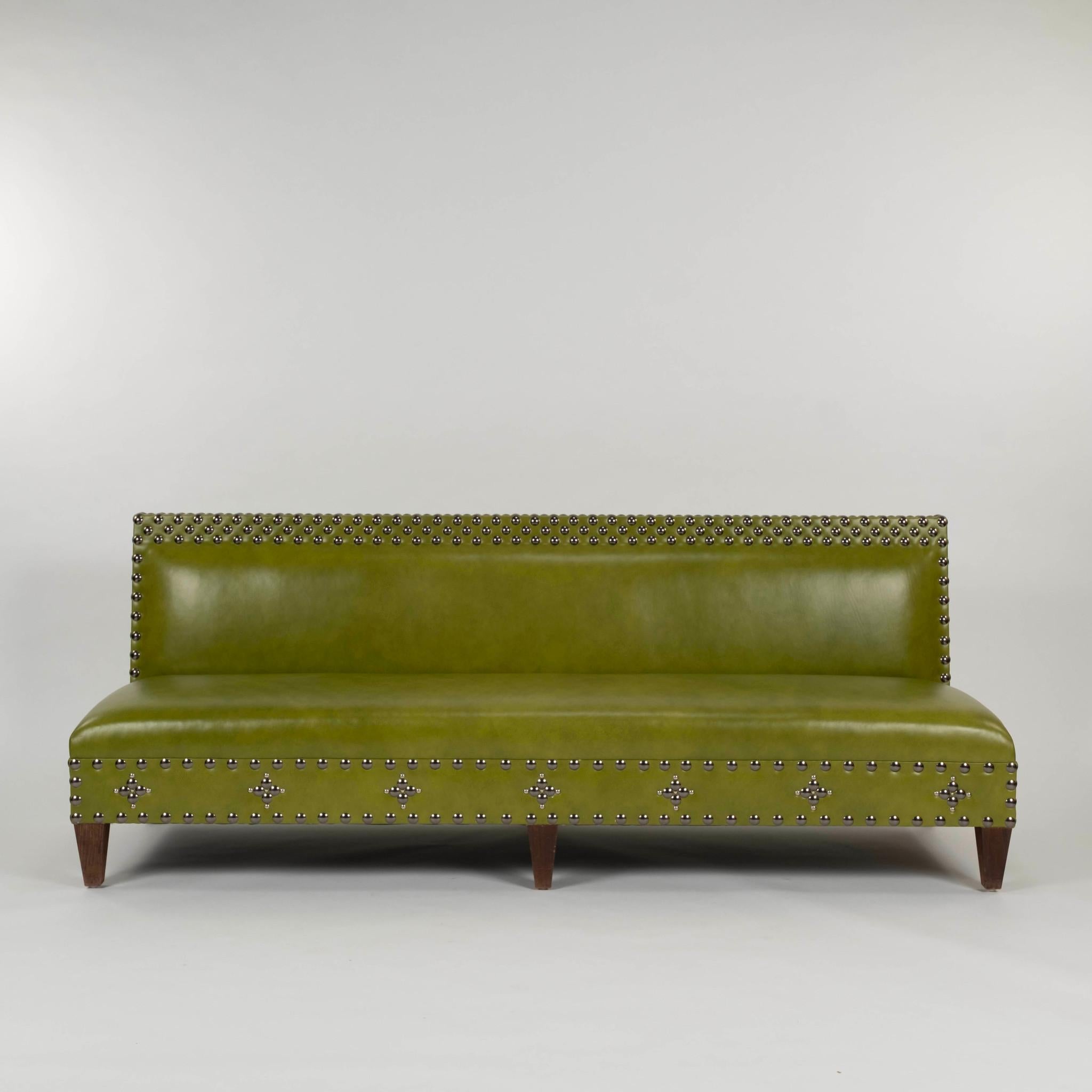21st-Century apple green leather banquette with dark walnut tapered legs and custom nailhead detail.