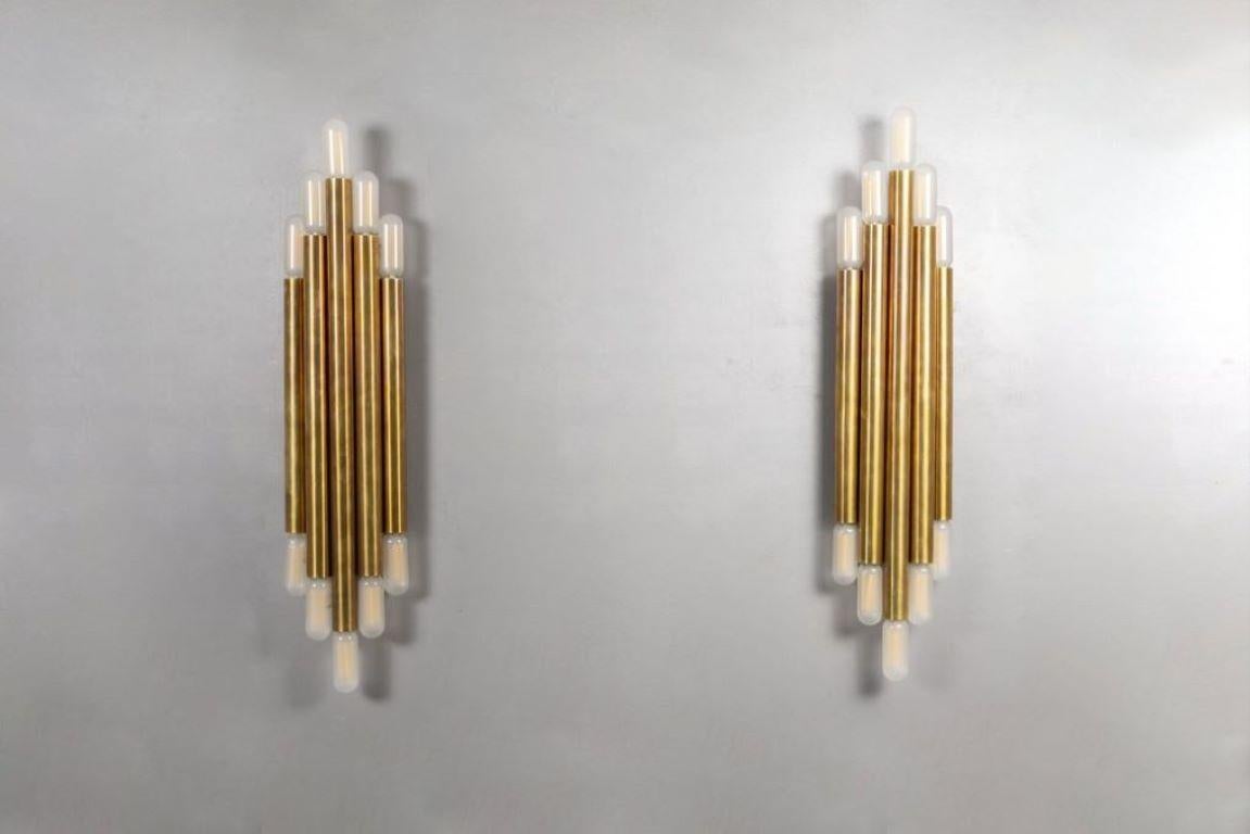 Wall lamps made entirely of full brass 10 lights each, reminiscent of the style of the master of Italian design Gio Ponti, are in excellent condition and suitable for any type of environment, elegant and refined have a style that combines the