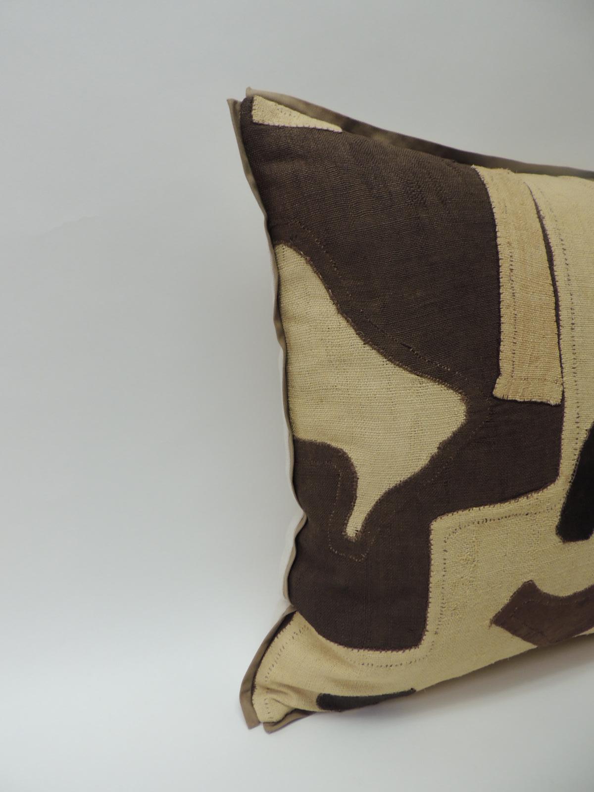 Applique raffia, patchwork and applique brown, black and natural decorative pillow,
Custom flat cotton trim in earth-tone khaki color all around. Natural Cotton and linen backing.  Pillow hand-crafted and designed in the USA with custom made